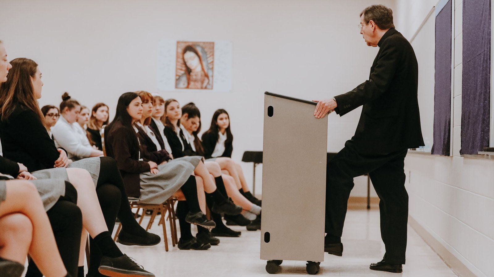 Archbishop Vigneron leads a question-and-answer session with students at St. Catherine of Siena Academy in Wixom during a pastoral visit to the school April 2, 2019. (Melissa Moon | Detroit Catholic file photo)
