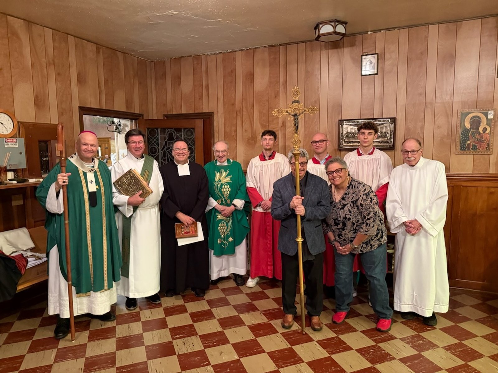 Archbishop Weisenburger and fellow clergy take a group picture along with sacristans and Mass servers before the centennial Mass begins.