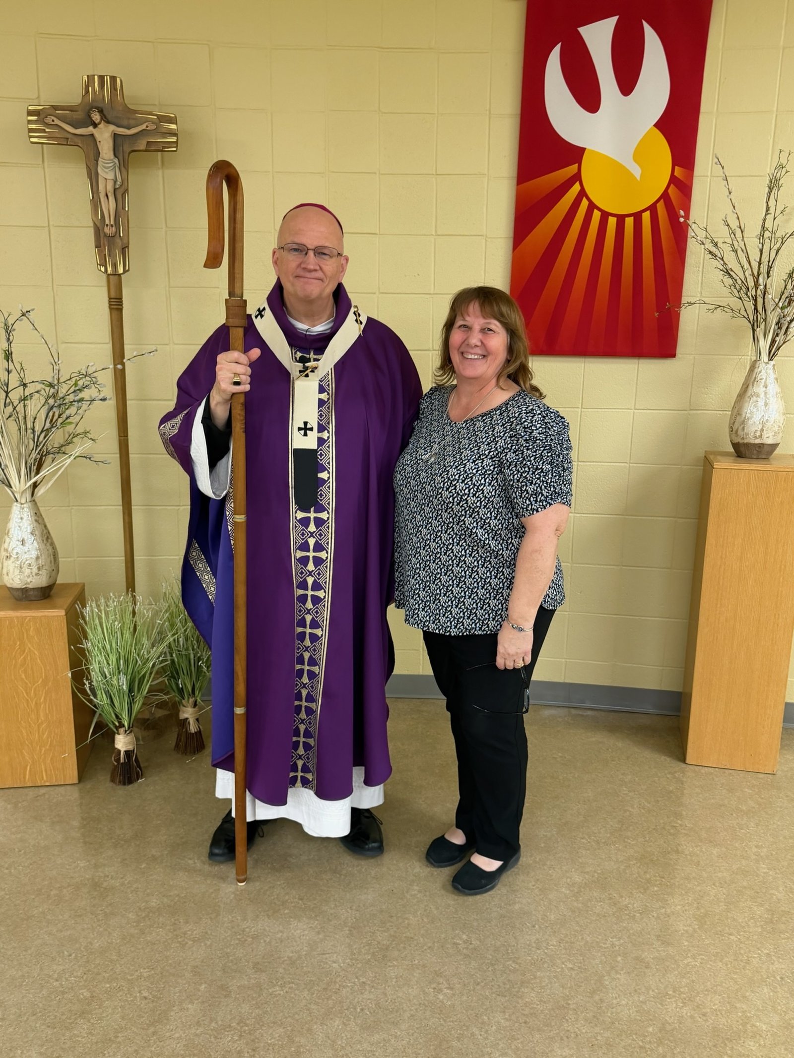 Archbishop Weisenburger with parish catechist Janice Krygowski.
