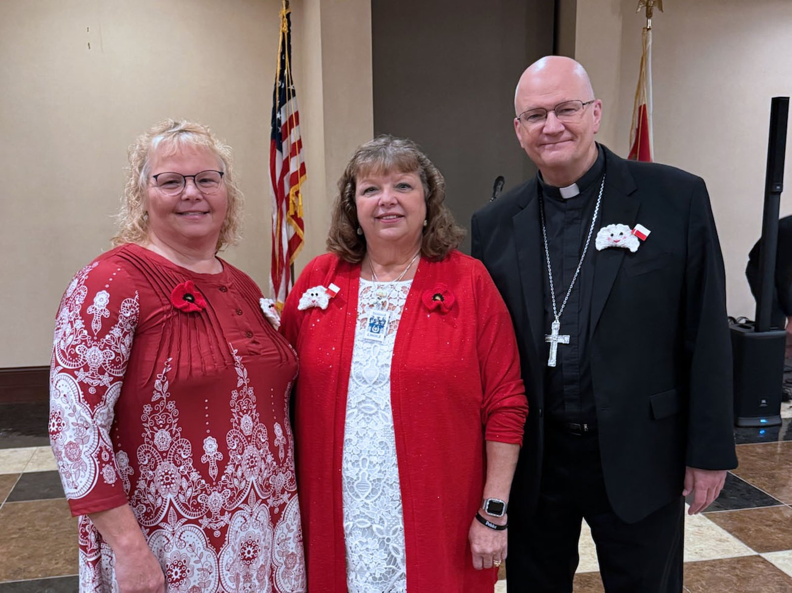 Archbishop Weisenburger wears a homemade pierogi lapel, made for him by parishioners of St. John Paul II Parish in Detroit. The parish is near the border with Hamtramck, a traditionally Polish enclave.