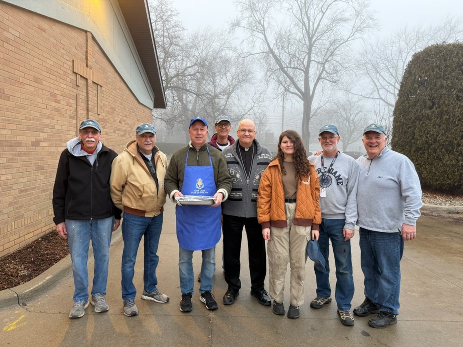 Archbishop Weisenburger with the “fry team.”