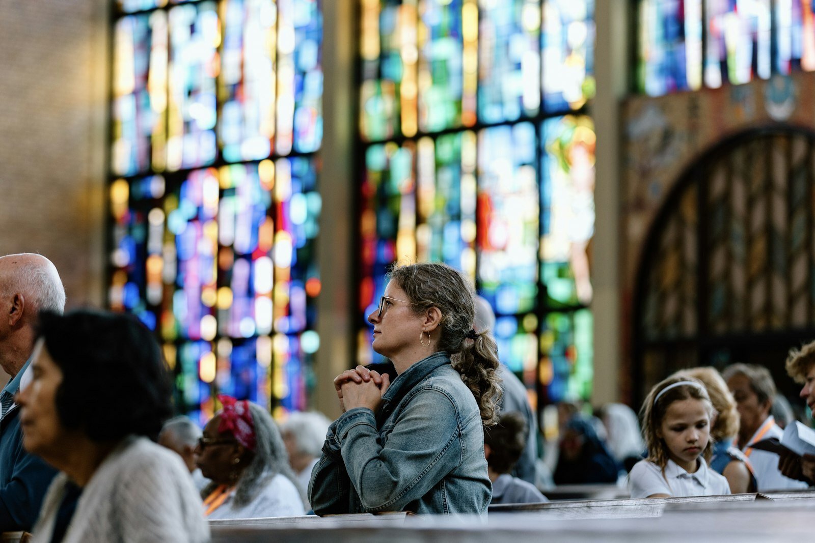 Catholics kneel in adoration at St. Scholastica Parish in northwest Detroit. The day also included lively talks, confession, Mass and a service drive in the parish center. (Alissa Tuttle | Special to Detroit Catholic)