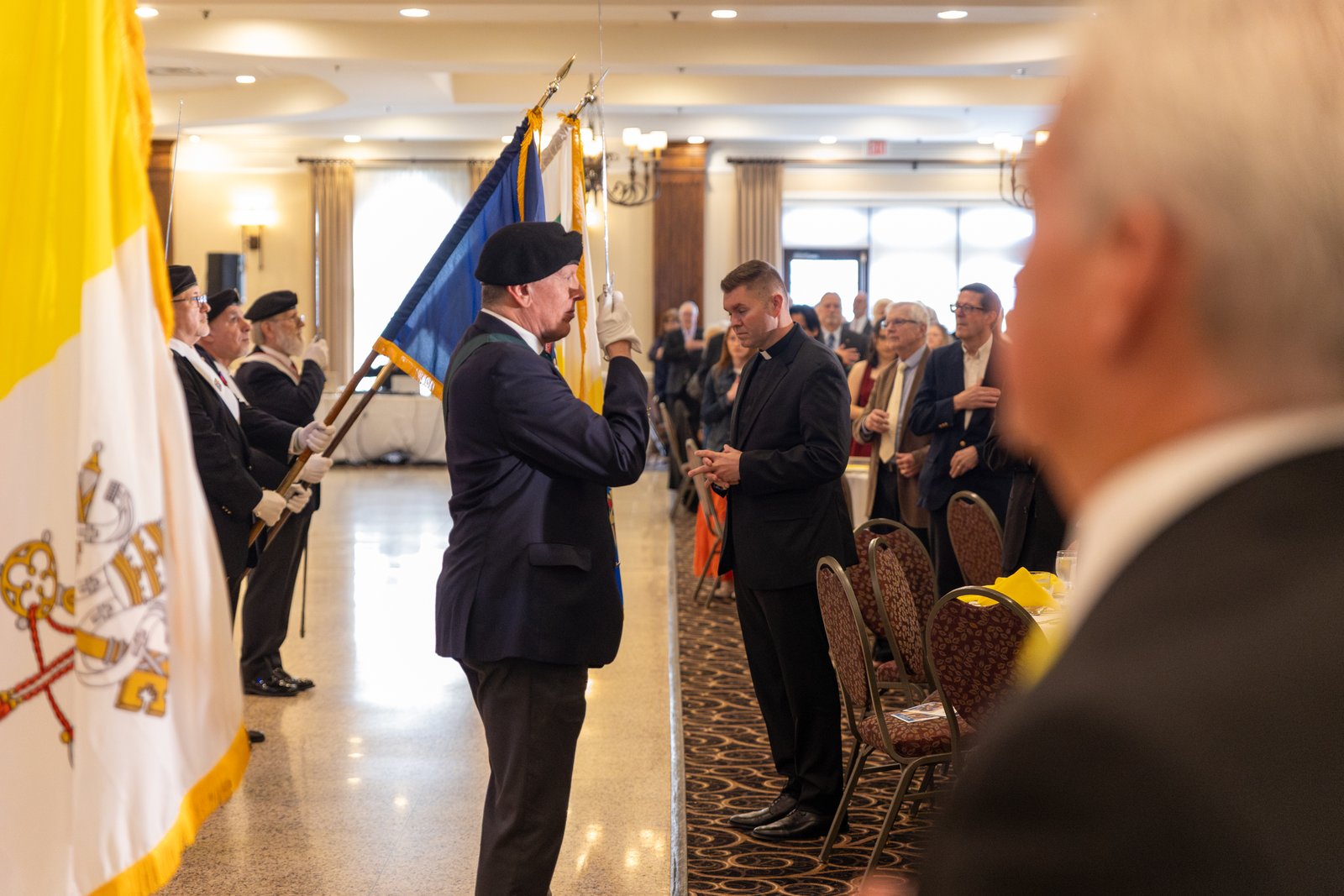 The Knights of Columbus present colors and draw their swords during the recitation of the Pledge of Allegiance. It was the Knights of Columbus who advocated for the inclusion of "One nation under God," in the pledge.