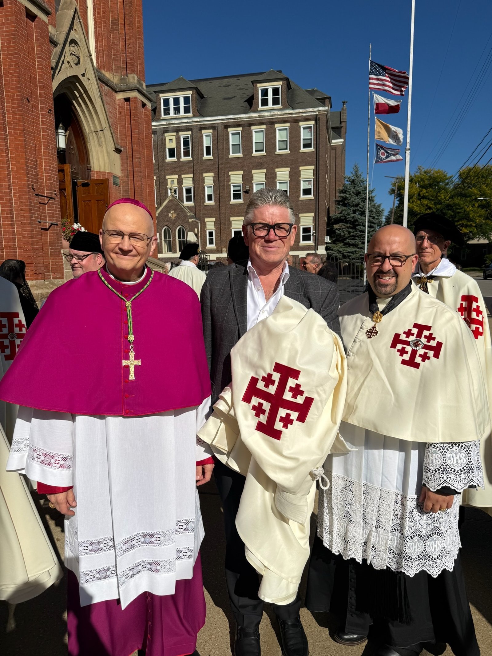 Archbishop Weisenburger with Patrick Greek, center, a new member of the order, and his pastor, Fr. Salvatore Palazzolo, right.