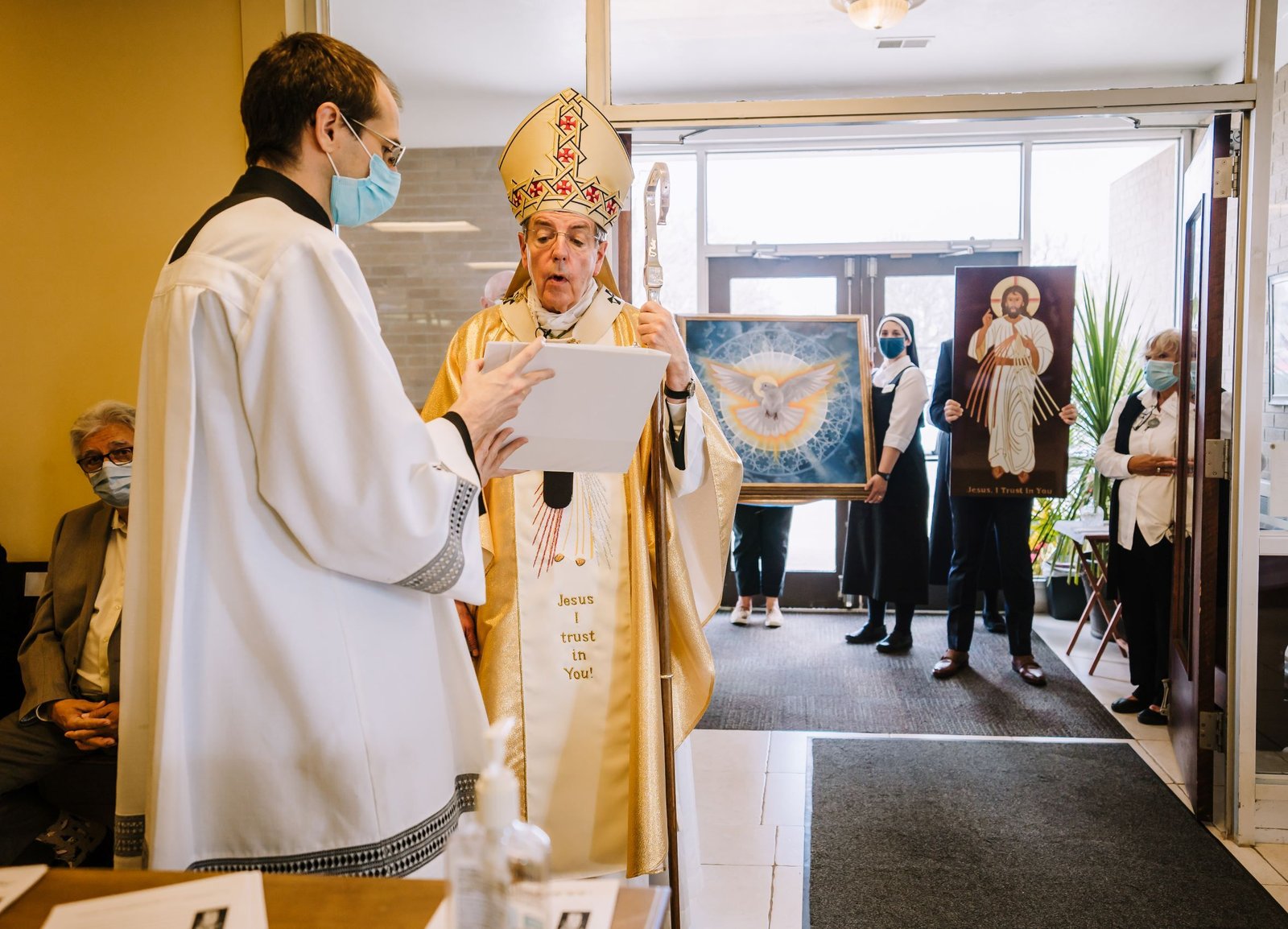 Archbishop Allen H. Vigneron reads a decree officially dedicating the Divine Mercy Center in Clinton Township as an archdiocesan shrine, the Shrine of Jesus the Divine Mercy, on Divine Mercy Sunday, April 11, 2021. (Valaurian Waller | Detroit Catholic)