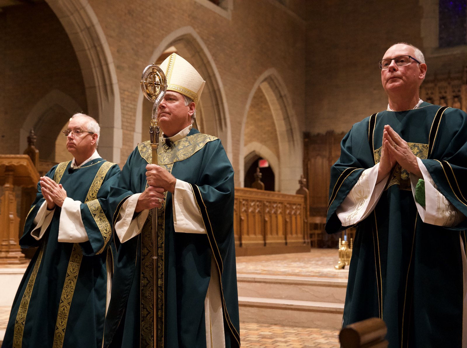 Auxiliary Bishop Robert J. Fisher waits to accept the gifts of the altar during the 29th annual Mass for Commerce on Oct. 26 at Sacred Heart Major Seminary.