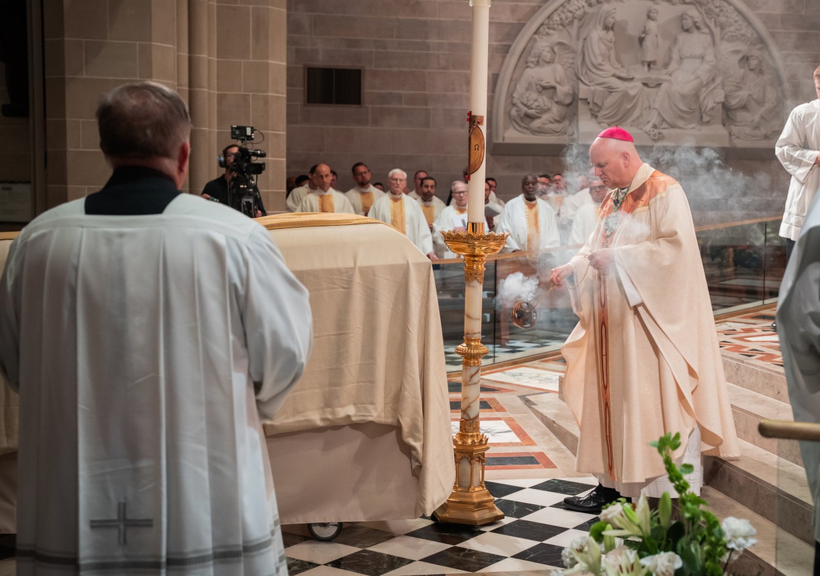 Archbishop Weisenburger blesses the casket of Archbishop Michael J. Byrnes with incense at the start of Archbishop Byrnes' funeral Mass on June 9 at the Cathedral of the Most Blessed Sacrament in Detroit.