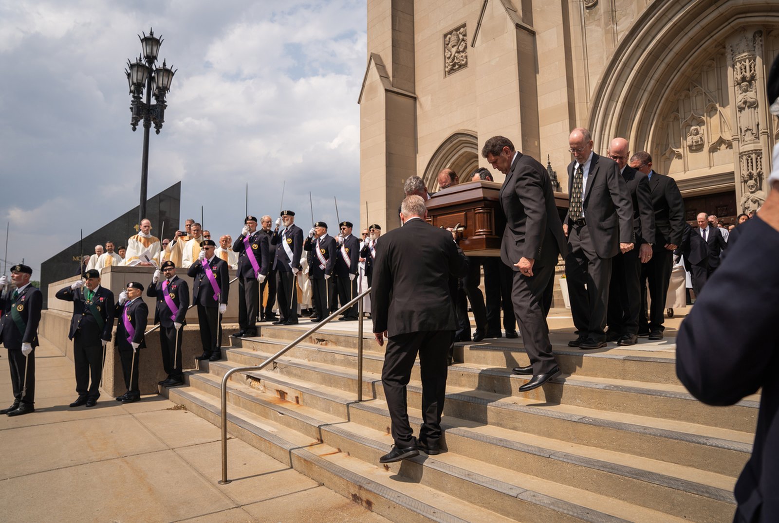 Pallbearers carry the casket of Archbishop Michael J. Byrnes down the steps of the Cathedral of the Most Blessed Sacrament to a waiting hearse, which would carry the archbishop to his final resting place at Holy Sepulchre Cemetery in Southfield.