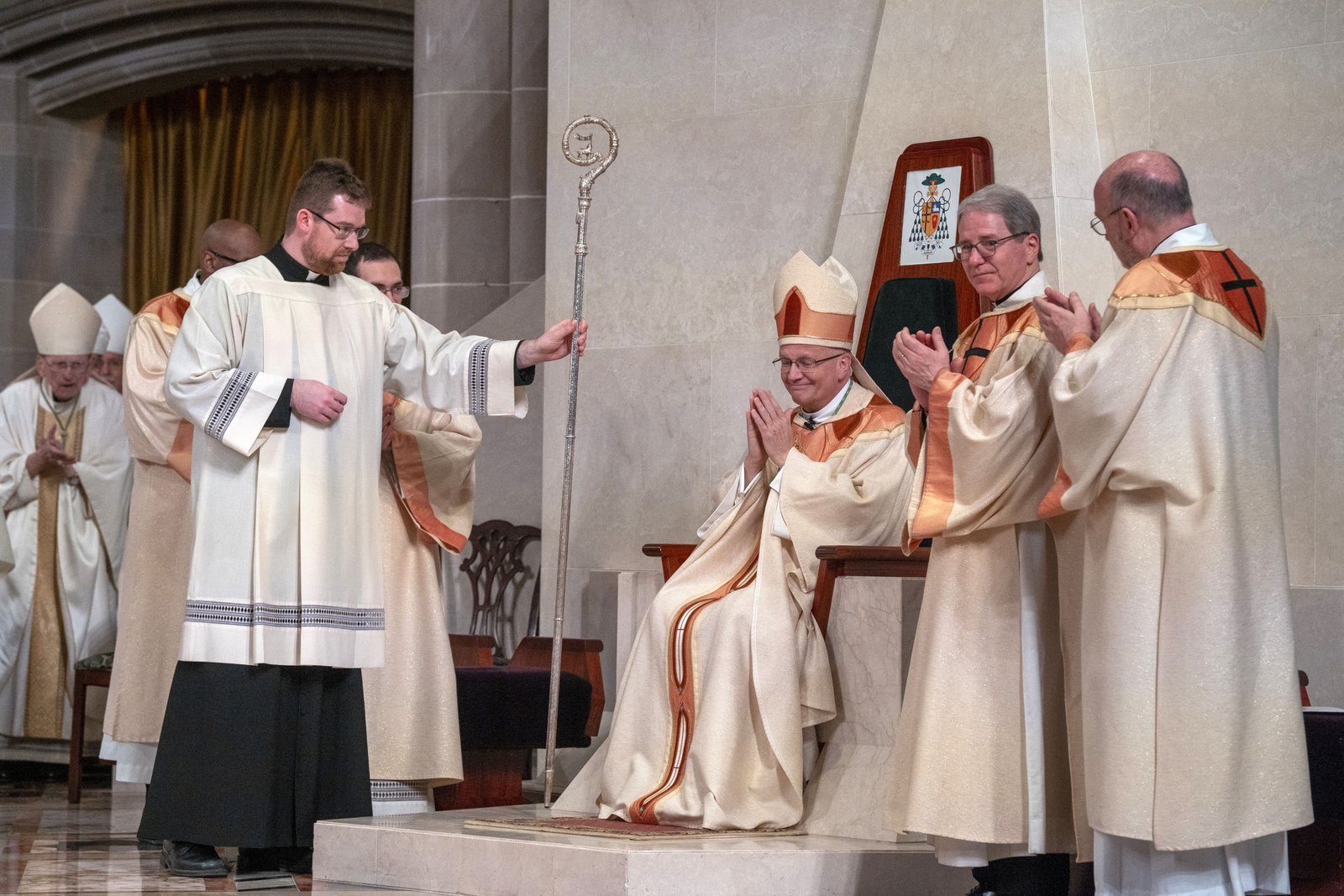 Archbishop Weisenburger acknowledges the applause of the faithful of the Archdiocese of Detroit, who greeted him for the first time as their chief shepherd March 18 following a solemn Mass of installation at the Cathedral of the Most Blessed Sacrament. (Valaurian Waller | Detroit Catholic)
