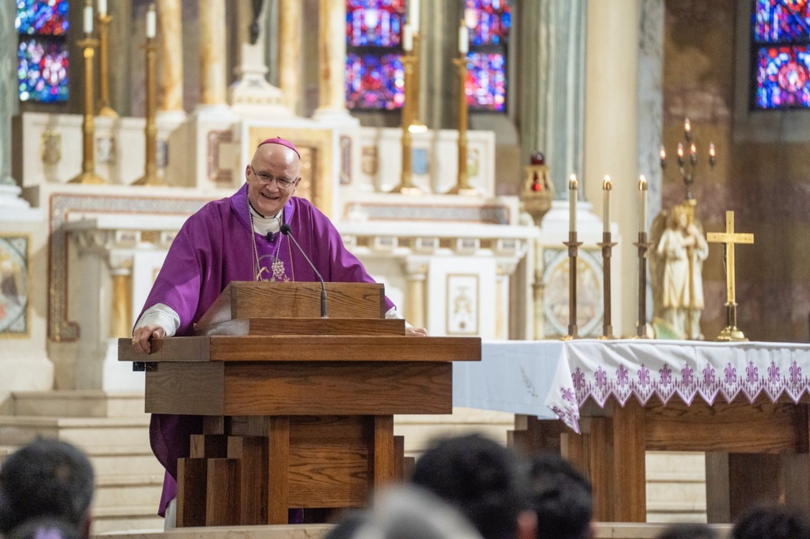Archbishop Edward J. Weisenburger delivers his homily during a Mass of welcome March 20 at Holy Redeemer Parish in Detroit. The archbishop spoke in both Spanish and English during the Mass and reception to follow.