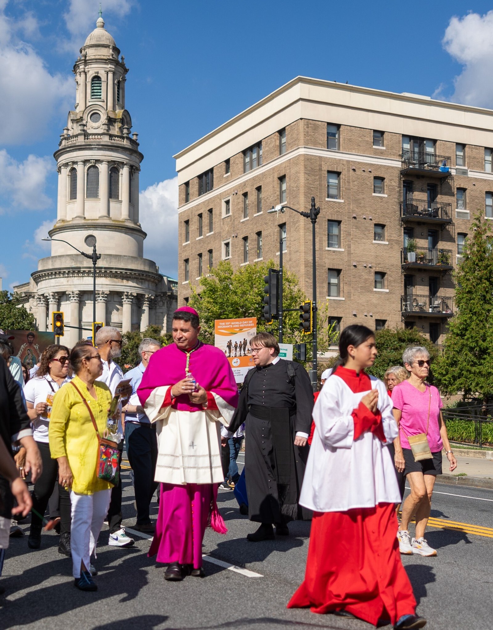 Washington Auxiliary Bishop Evelio Menjivar, at center, helps lead a reflection procession on Sept. 28, 2025 to mark the 111th World Day of Migrants and Refugees. The procession began at the Shrine of the Sacred Heart in Washington and concluded at the Cathedral of St. Matthew the Apostle, where Cardinal Robert W. McElroy celebrated a Mass marking that day. (Catholic Standard photo by Mihoko Owada)