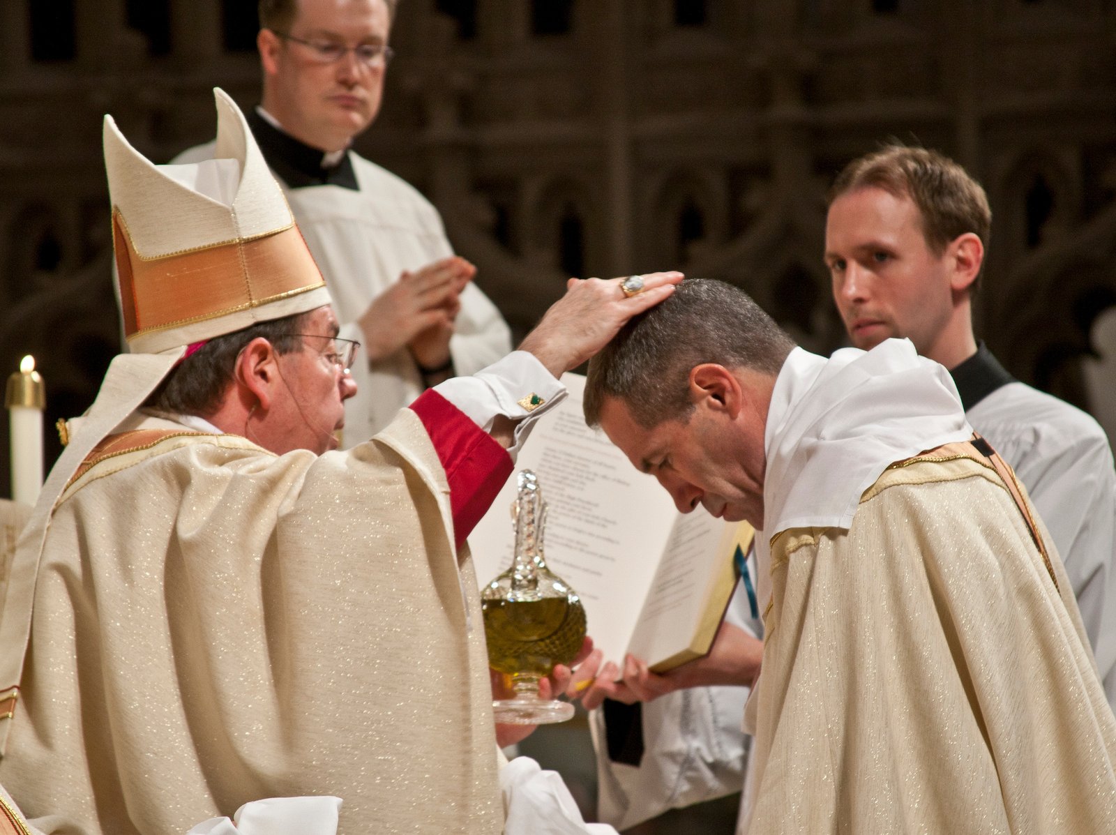 Archbishop Allen H. Vigneron, left, anoints the head of Archbishop Michael J. Byrnes during the latter's ordination to the episcopacy on May 5, 2011, at the Cathedral of the Most Blessed Sacrament. (Larry A. Peplin | Detroit Catholic file photo)