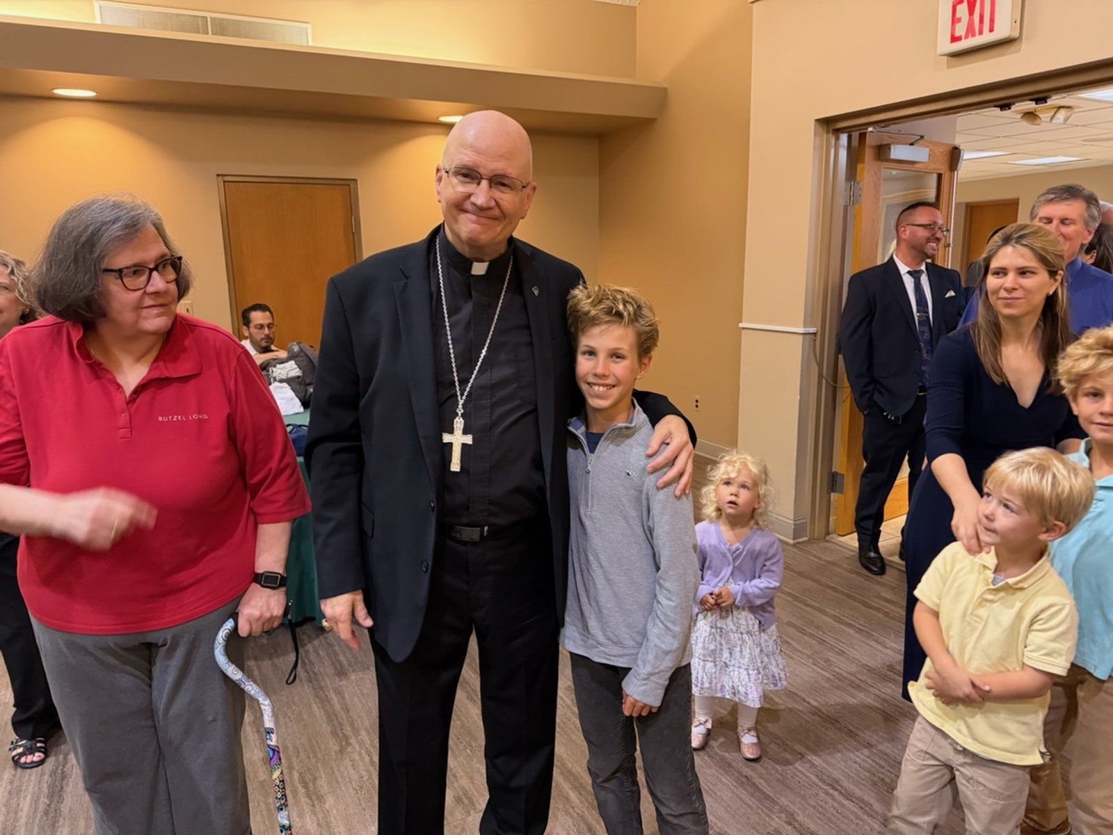 The Archbishop poses with Michael, the altar server for the morning Mass at Holy Name.
