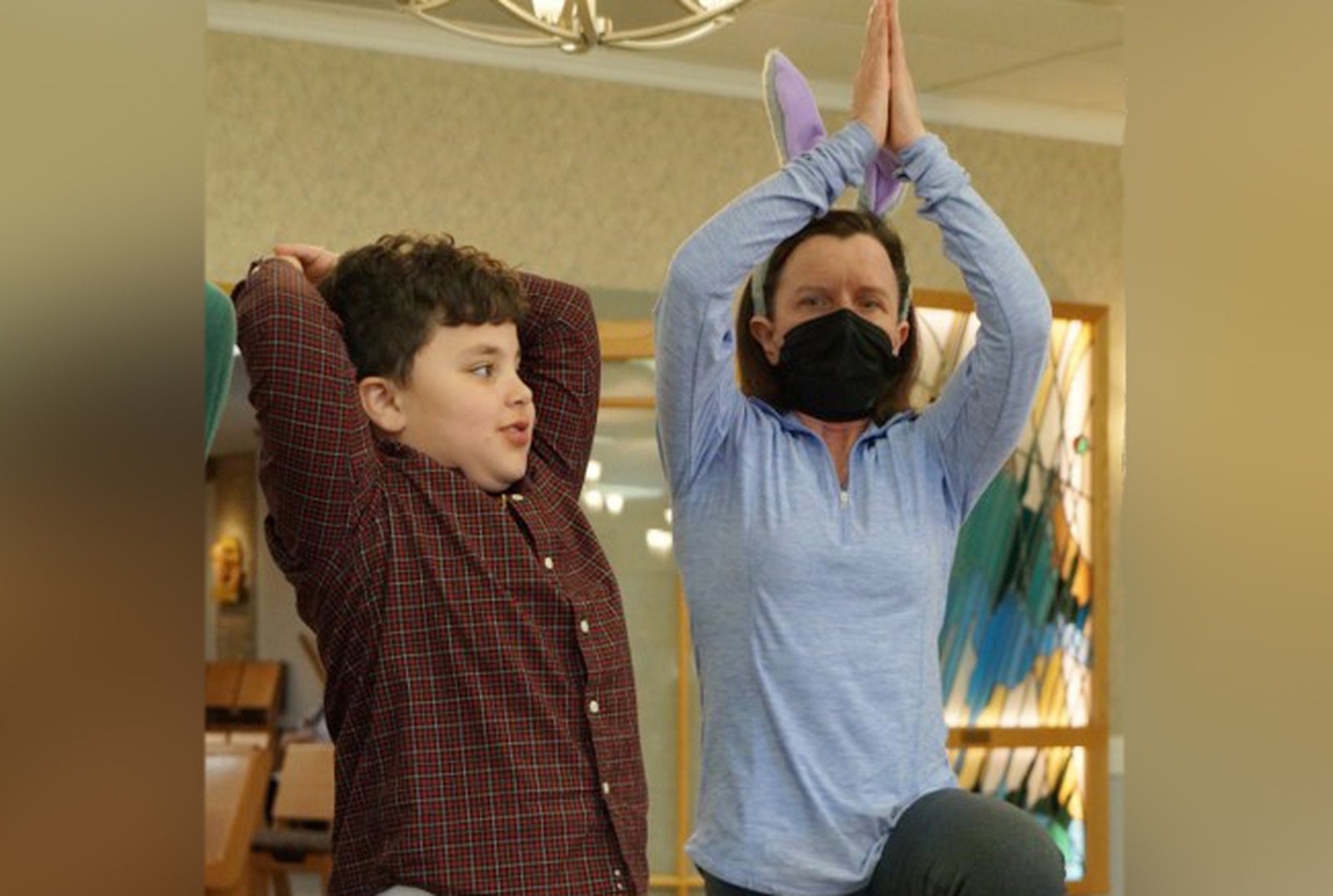 Physical therapist Amy Mittelstaedt teaches students stretches and exercises as student Emanual Hermiz tries them out April 9. Mittelstaedt and Dr. Eva Molenda regularly give talks and lessons to the group about healthy living, good posture and eating habits.