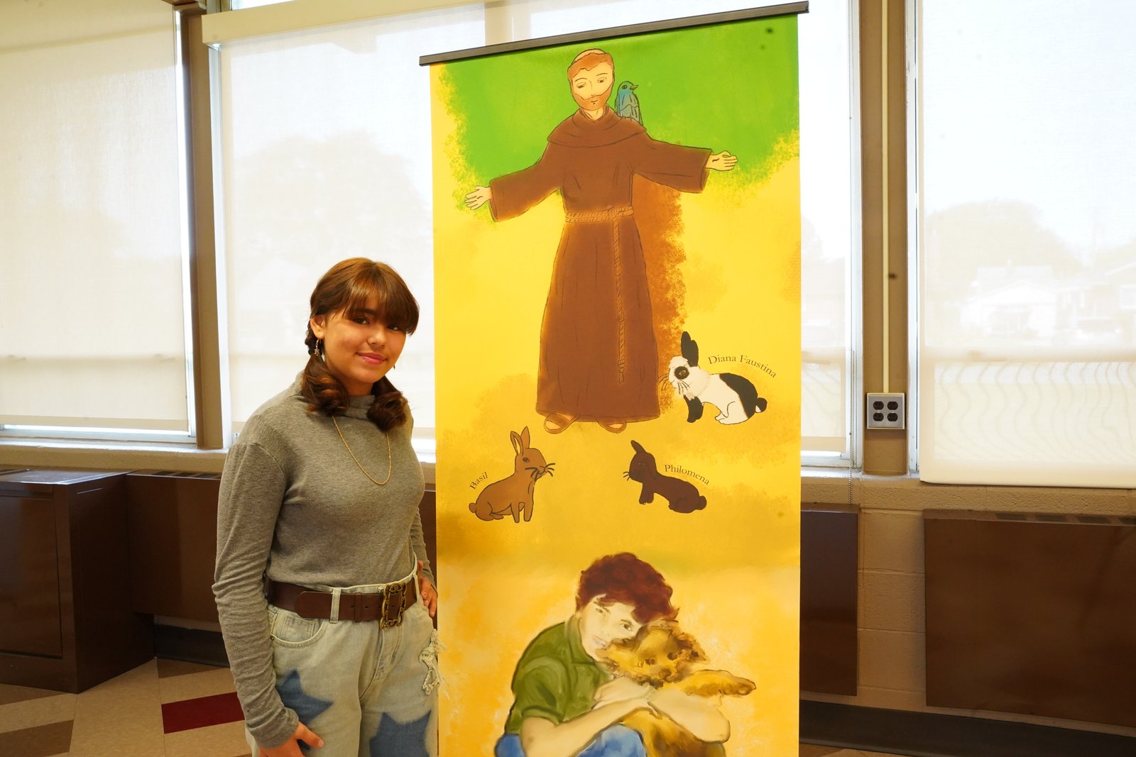 Gianna Narduzzi chose to focus on Blessed Carlo's love for animals in her artwork, noting how he had a number of pets in his lifetime. The three bunnies in the drawing represent Diana Faustina, her own bunny; Philomena, Fr. Eric Fedewa, pastor of St. Basil's, bunny; and Basil, who belongs to another family in the parish. (Daniel Meloy | Detroit Catholic)