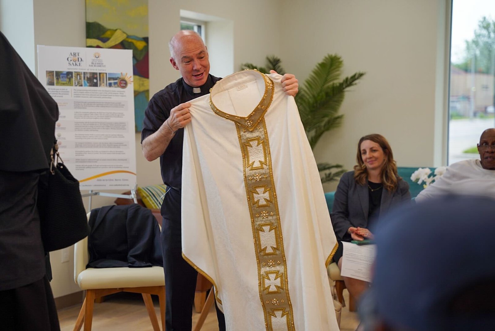 As a gesture of gratitude to Fr. J.J. Mech for his work on the Cathedral Arts Apartments project, MHT Housing and other partners involved in the project gifted the cathedral rector with a chasuble made in Rome by the same people who manufacture the pope's liturgical garments.