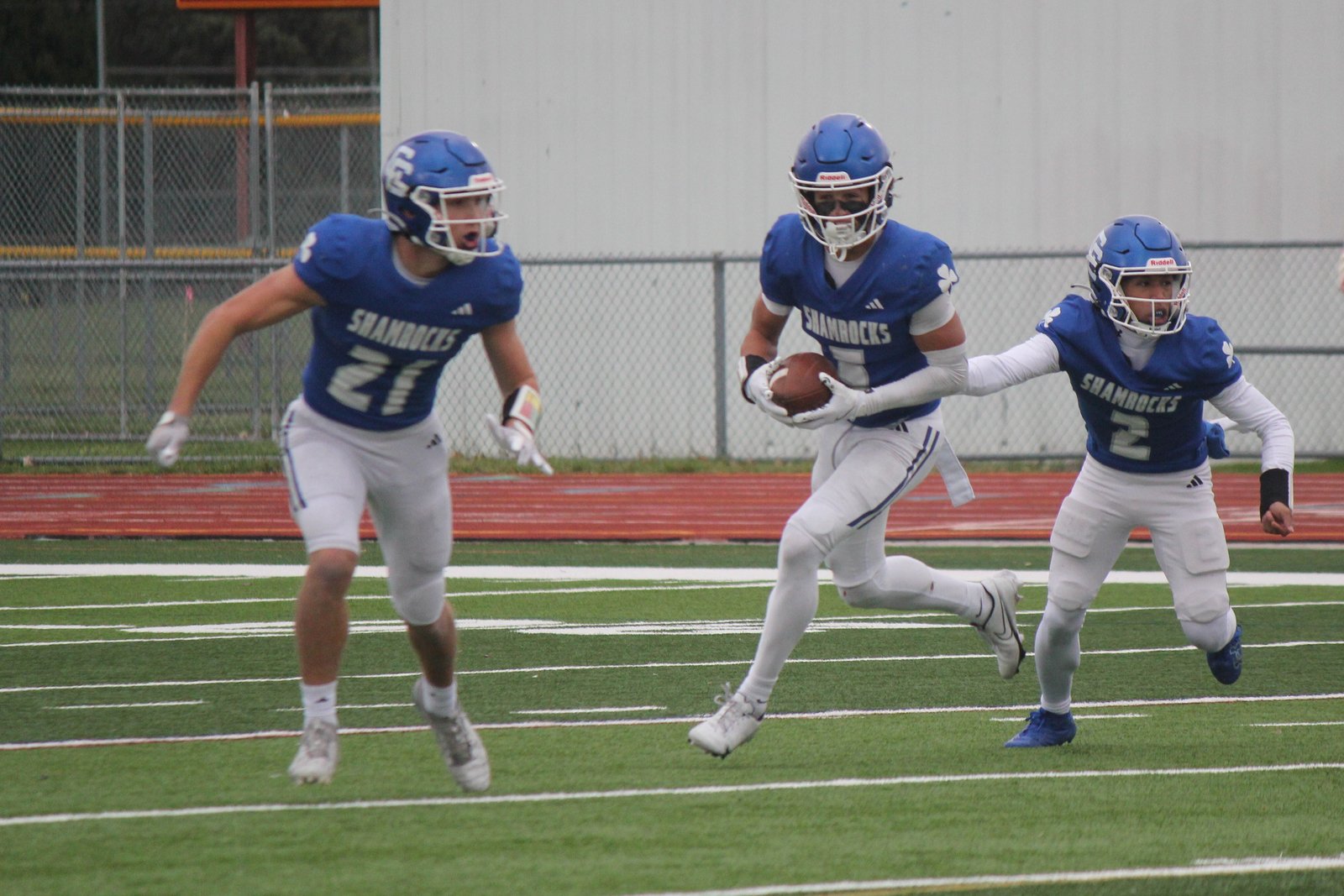 Samson Gash (5) carries the football for Novi Detroit Catholic Central in last year’s semifinal defeat to Detroit Cass Tech. Since then, Gash won the 100-meter dash event at the state track finals, and is no longer under the radar, making the Shamrocks one of the state’s elite teams this fall.