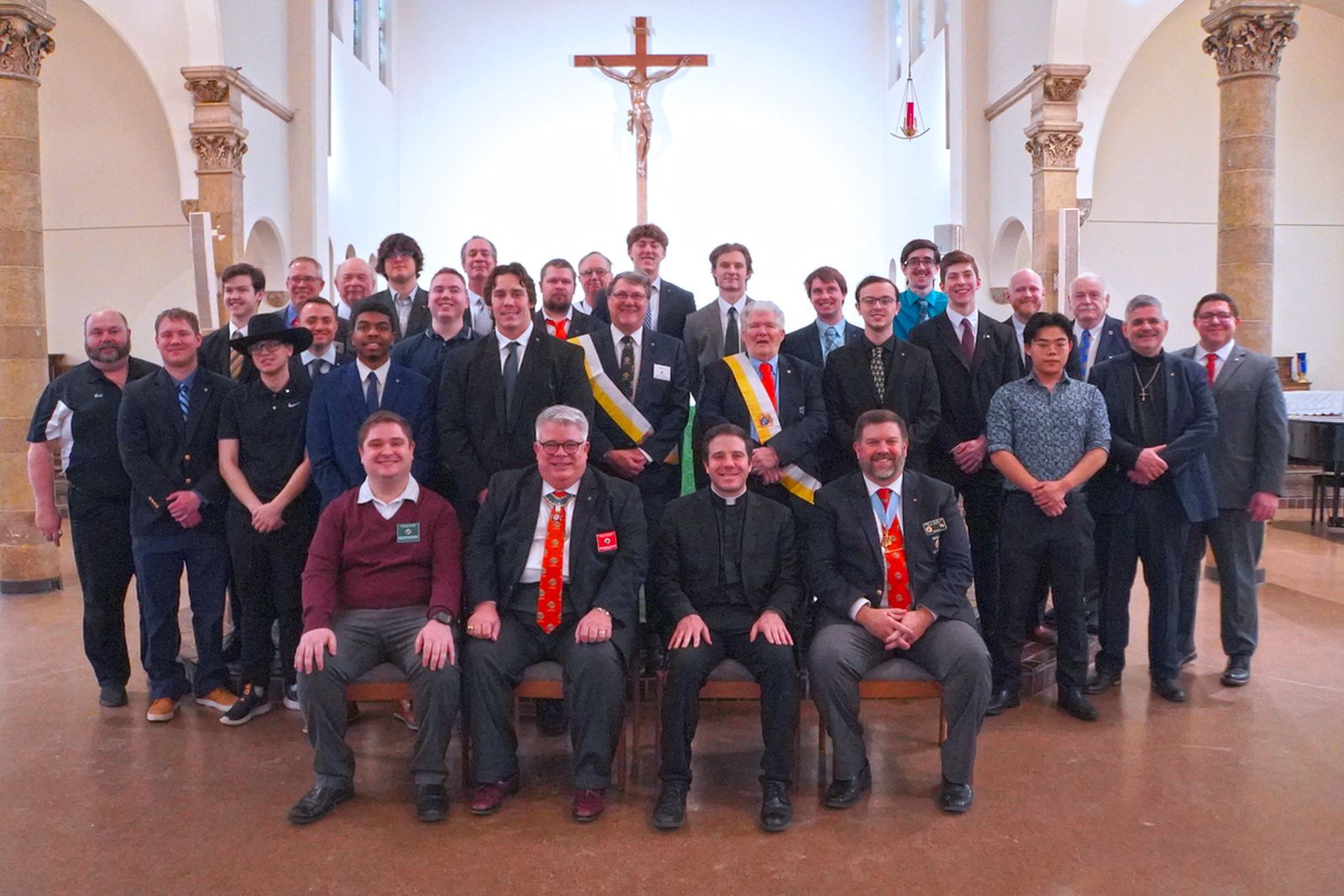 The founding members of the Blessed Carlo Acutis Council of the Knights of Columbus, based out of Detroit Catholic Campus Ministry, pose for a group photo following their exemplification with representatives from the Knights of Columbus and chaplain Fr. Matthew Hood. The council is the second college-based council in Michigan.