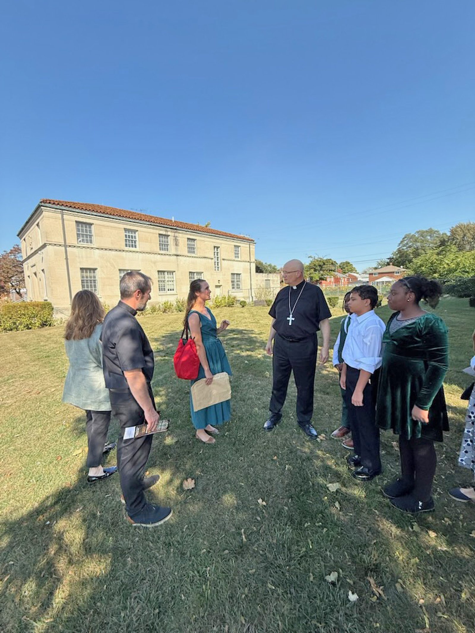 Archbishop Weisenburger receives a tour of the church and school grounds, which include more than a dozen projects over the past decade designed to be good stewards of the environment.