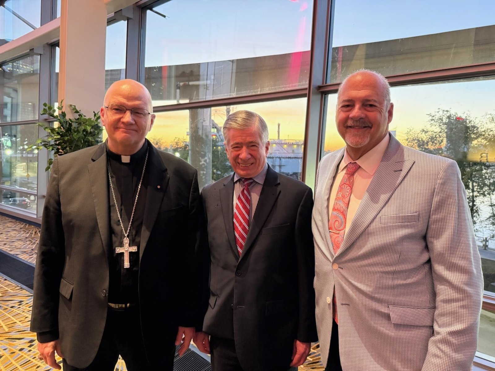 Archbishop Weisenburger visits with dignitaries prior to the beginning of the 2025 annual Detroit Goodfellows celebration.