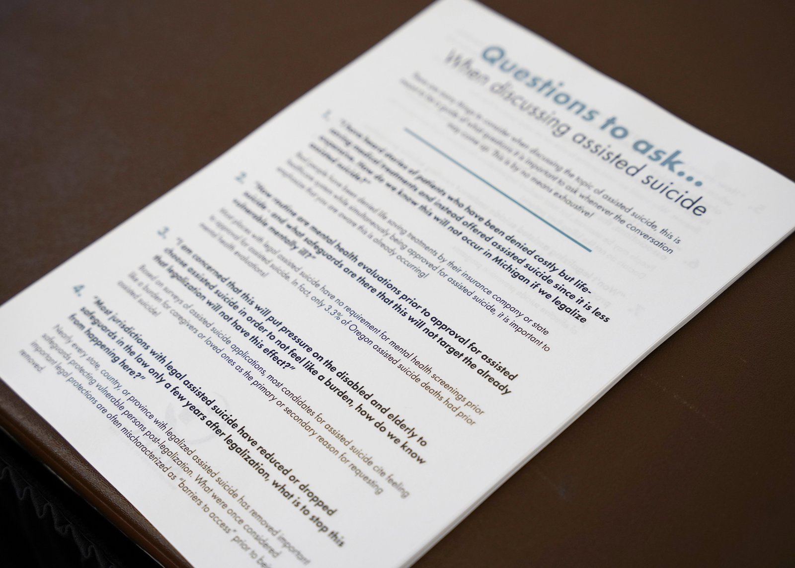 Event organizers encouraged participants to pick up guides to help them discuss physician-assisted suicide amidst the ongoing societal debate about the controversial practice.