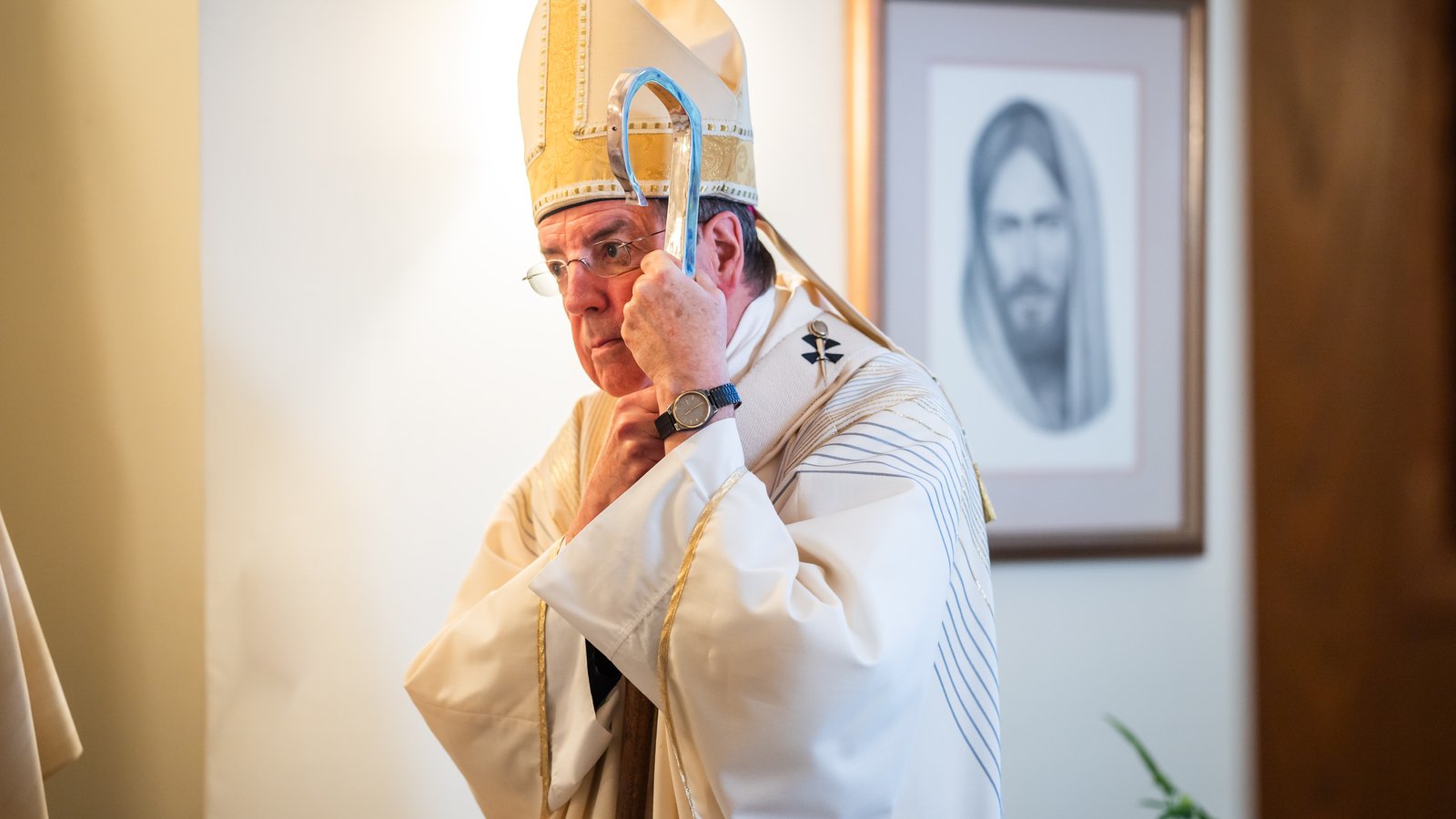 Archbishop Vigneron leans on his crozier before celebrating a candidacy Mass for seminarians Aug. 23, 2023, at Manresa Jesuit Retreat House in Bloomfield Hills. (Valaurian Waller | Detroit Catholic)