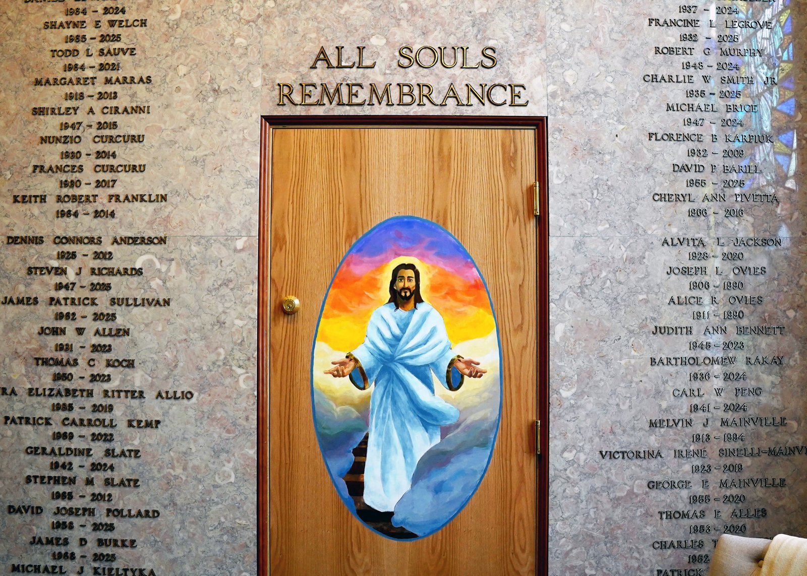 The All Souls Remembrance Room features a painting of Our Lord designed by a student at the Chesteron Academy of Our Lady of Guadalupe in Clinton Township, and is surrounded by the names of all those laid to rest inside.