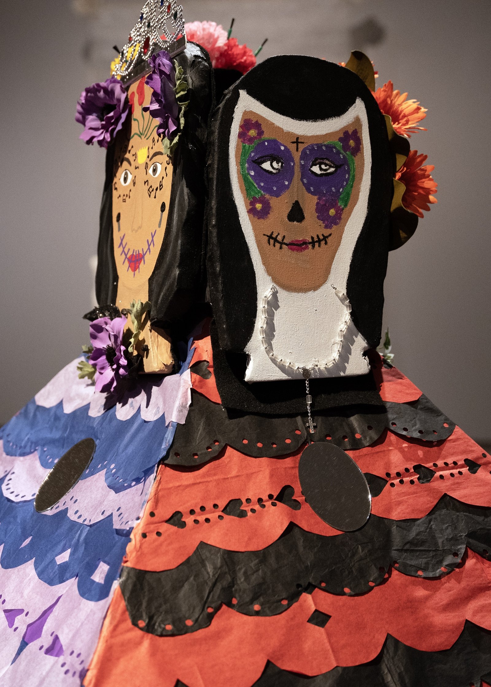 Musician Selena Quintanilla Pérez, left, and feminist and nun Sor Juana Inés de la Cruz, right, are two of the women depicted in Regina's ofrenda.