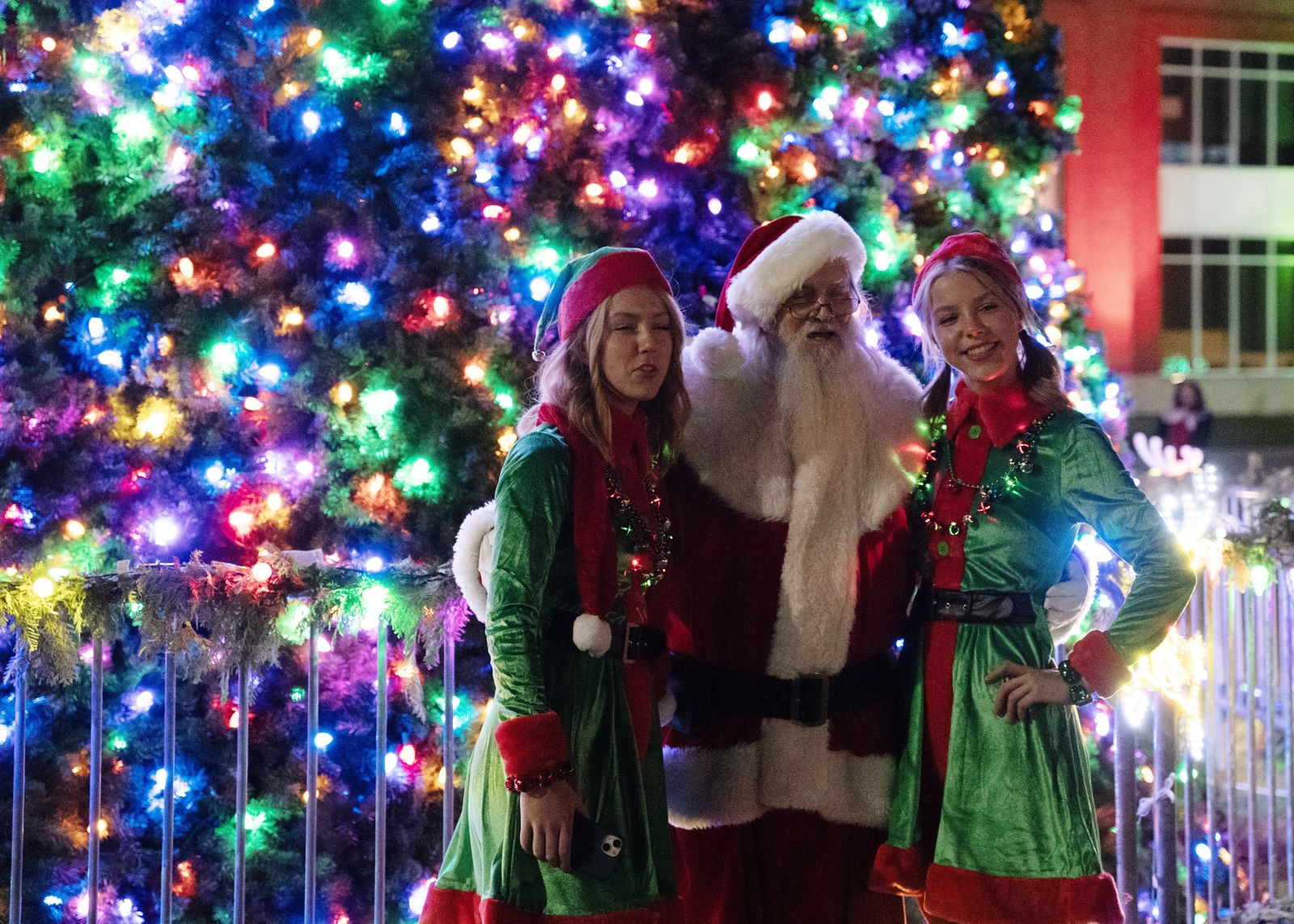 Amelia and Miriam Czarnik, juniors and twin sisters at St. Mary's Preparatory, served as Santa's elves during the "Mingle All the Way" event. (Gabriella Patti | Detroit Catholic)