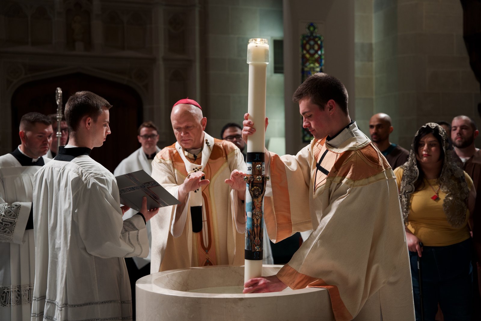 The Cathedral of the Most Blessed Sacrament was illuminated by candelight on Saturday evening, April 4, as Archbishop Edward J. Weisenburger began leading the faithful into the Easter season and warmly welcomed the newest members of the Church into her arms through the sacraments of baptism and confirmation. (Photos by Izzy Cortese | Detroit Catholic)