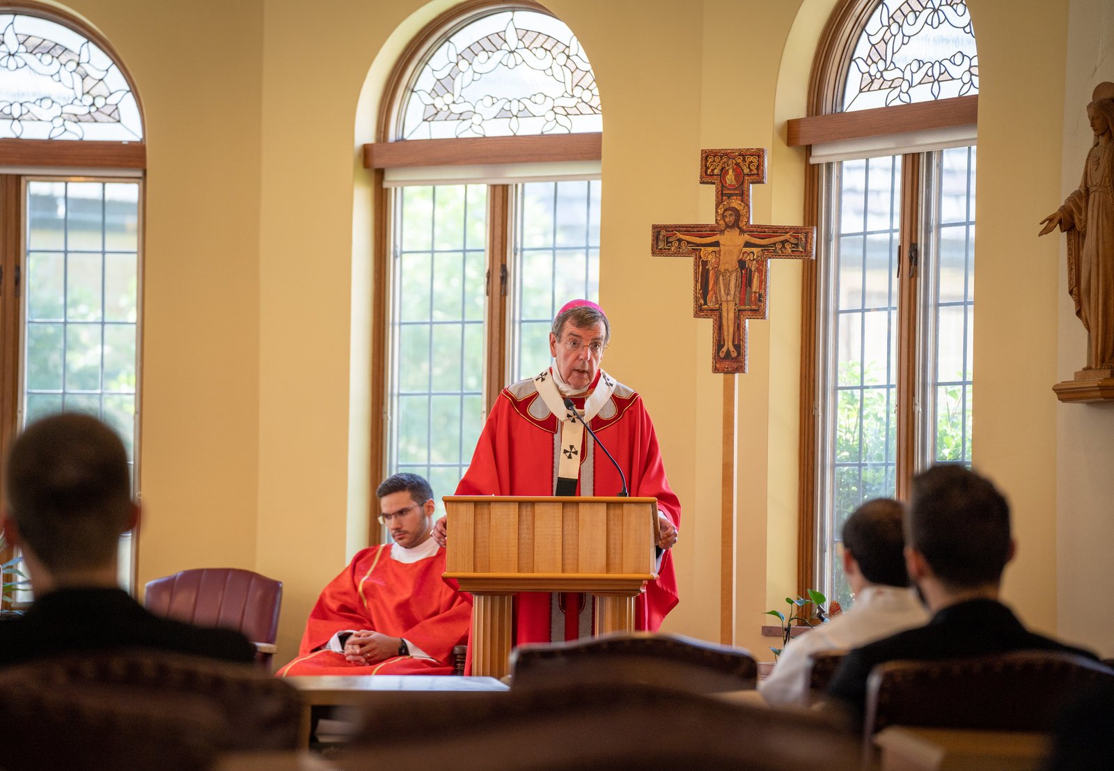 Archbishop Vigneron joins seminarians from Sacred Heart Major Seminary at Manresa Jesuit Retreat House in Bloomfield Hills for the annual candidacy Mass on Aug. 10, 2022. The archbishop said meeting with the seminarians and breaking open God's word with them has been among the highlights of his ministry each year, giving him the opportunity to "coach about priestliness." (Valaurian Waller | Detroit Catholic)