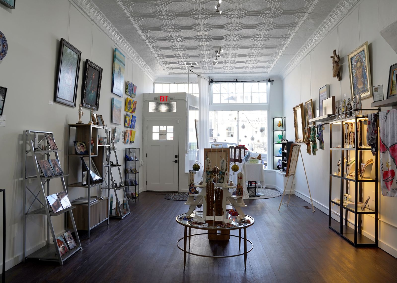 Although the collection is assorted, spanning from collage to photography to painting to Quesada’s own heirloom rosaries made from Venetian glass and Swarovski crystal, the space is cohesive, a testament Quesada says, to God’s hand in making this dream come true and with haste.