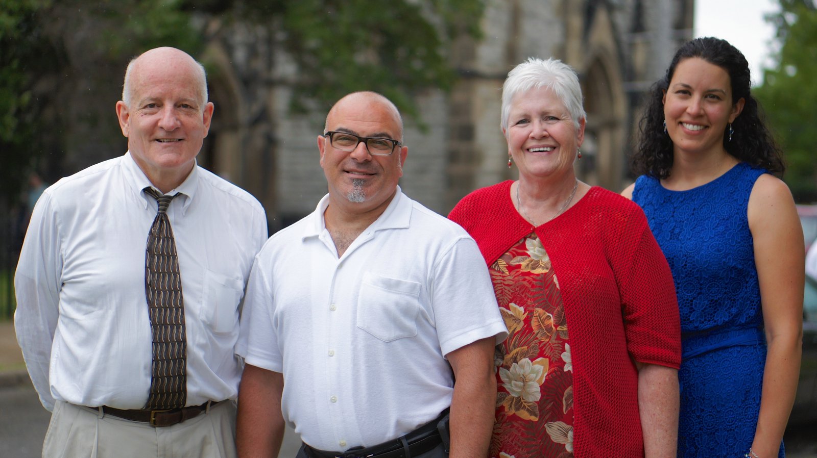 Detroit Mass Mob organizers, left to right, Thom Mann, Anthony Battaglia, the late Annamarie Barnes and Teresa Chisholm stand outside St. Joseph Church in Detroit on June 29, 2014. Not pictured is organizer Jeff Stawasz. (Tim Hinkle | Detroit Catholic file photo)