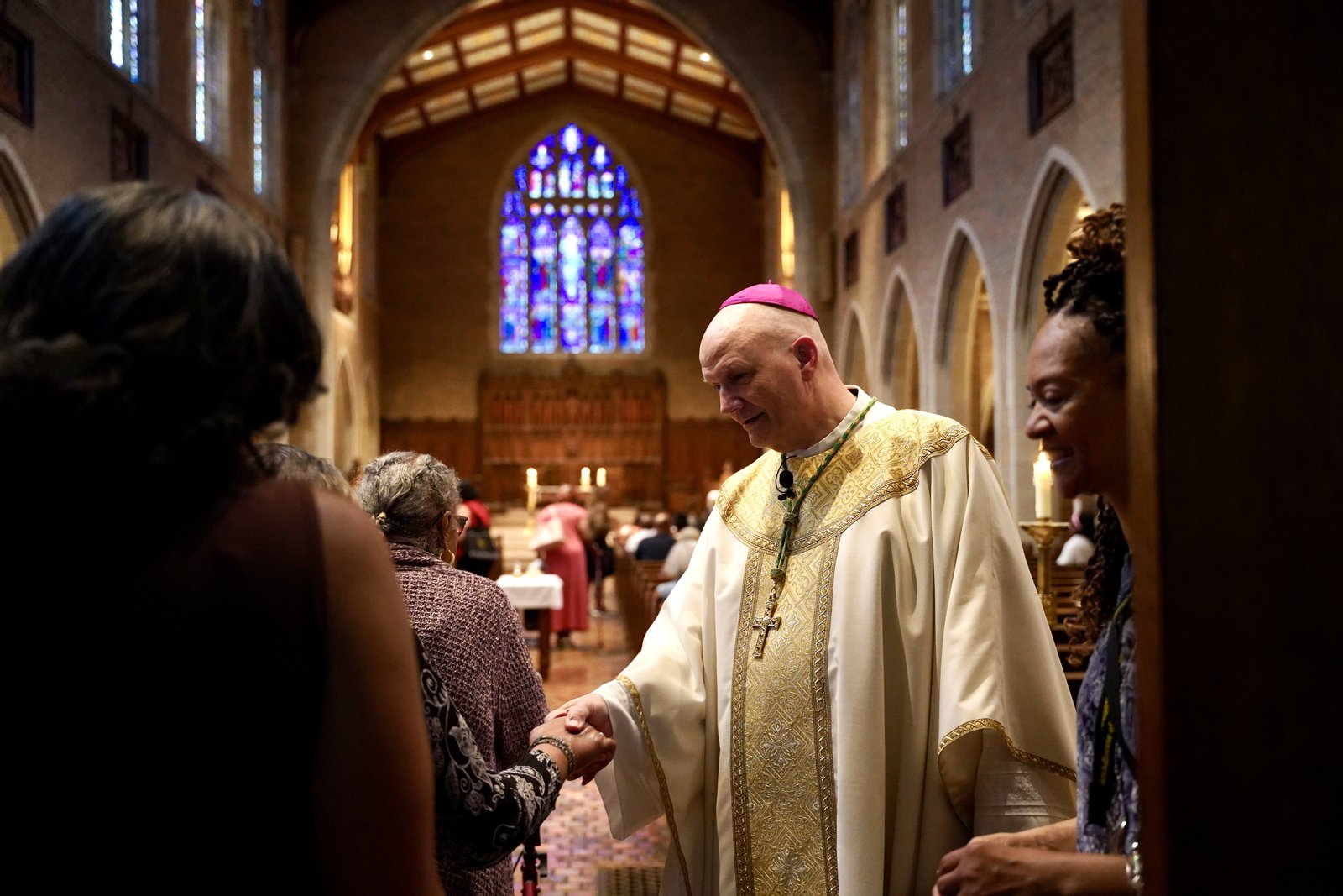 Detroit Archbishop Edward J. Weisenburger greets attendees at the start of Mass during the Black Catholic Women's Conference at Sacred Heart Major Seminary in Detroit.
