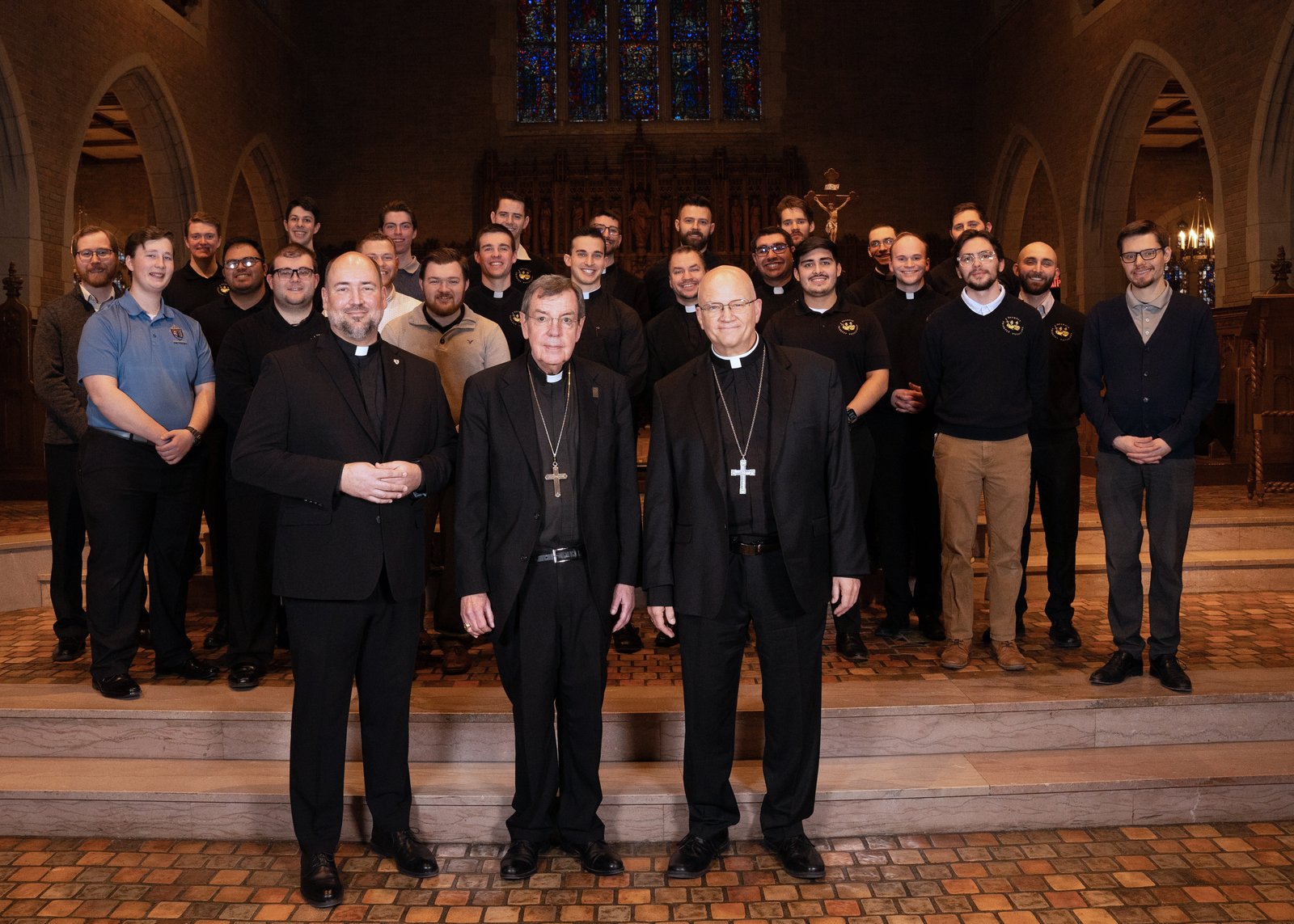 Detroit's seminarians pose for a photograph with Archbishop-designate Edward J. Weisenburger, retiring Archbishop Allen H. Vigneron and Fr. Stephen Burr, Sacred Heart's rector, in the seminary's chapel.