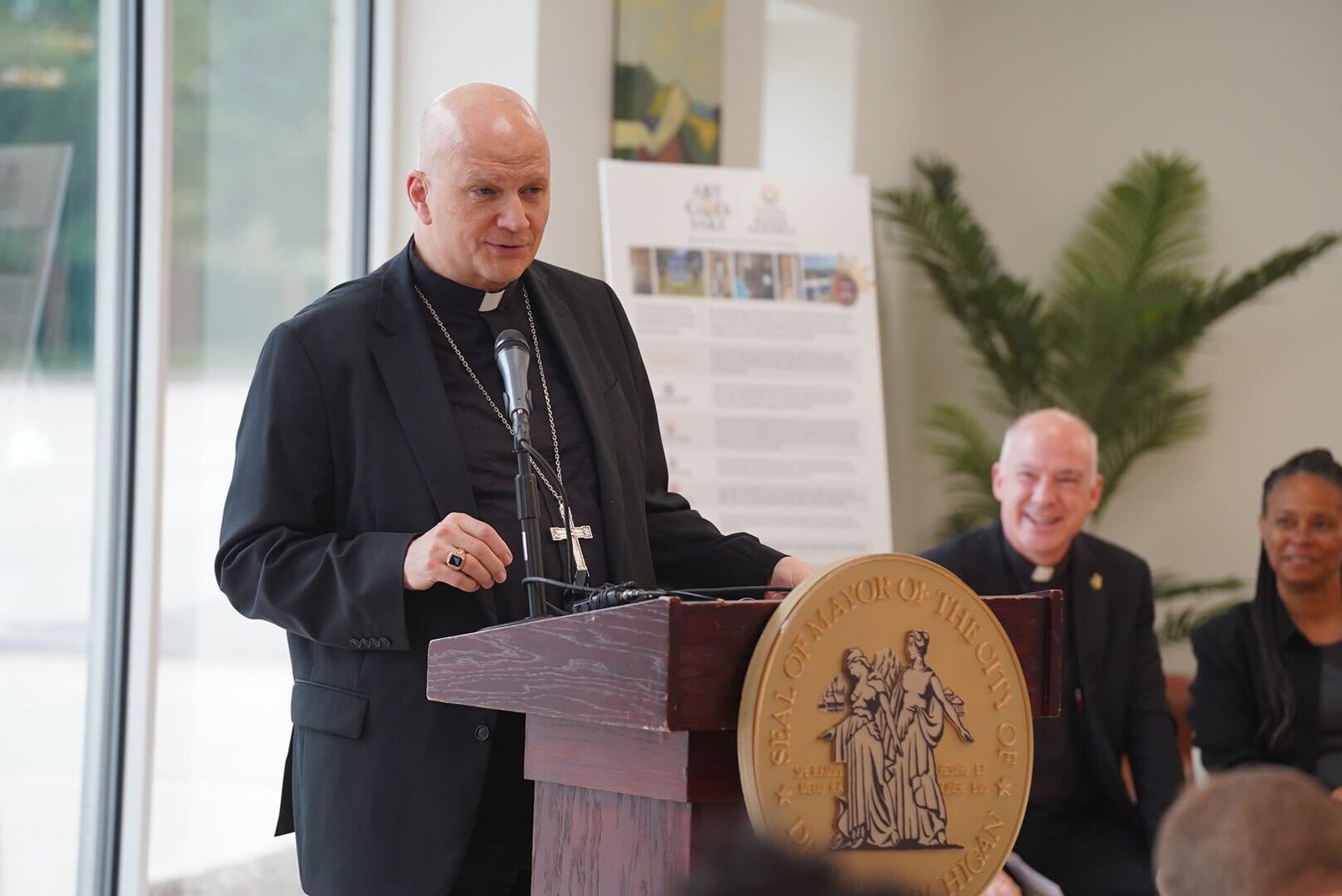 Detroit Archbishop Edward J. Weisenburger speaks during a news conference announcing the grand opening of the Cathedral Arts Apartments on June 12. Archbishop Weisenburger showed keen interest in the Cathedral Arts Apartments project when he first arrived to the Archdiocese of Detroit in March, seeing it as a way for the cathedral parish to build community in Detroit's North End neighborhood.