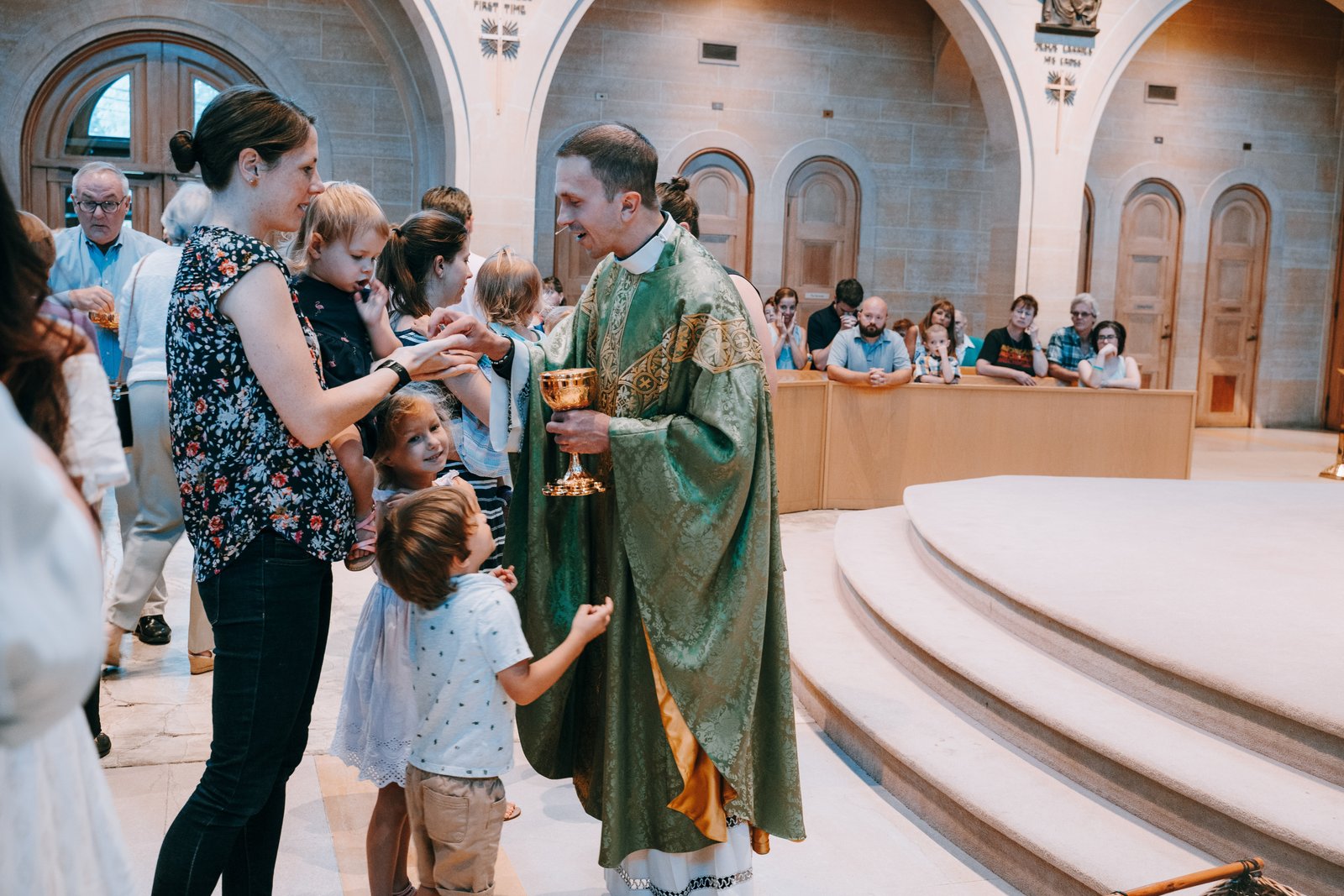 Fr. Paul Snyder distributes Communion to Massgoers at St. Mary Parish in Royal Oak on Ash Wednesday in 2019. Fr. Snyder said the parish's response to the vandalism is to "worship God and to honor Mary all the more." (Valaurian Waller | Detroit Catholic)