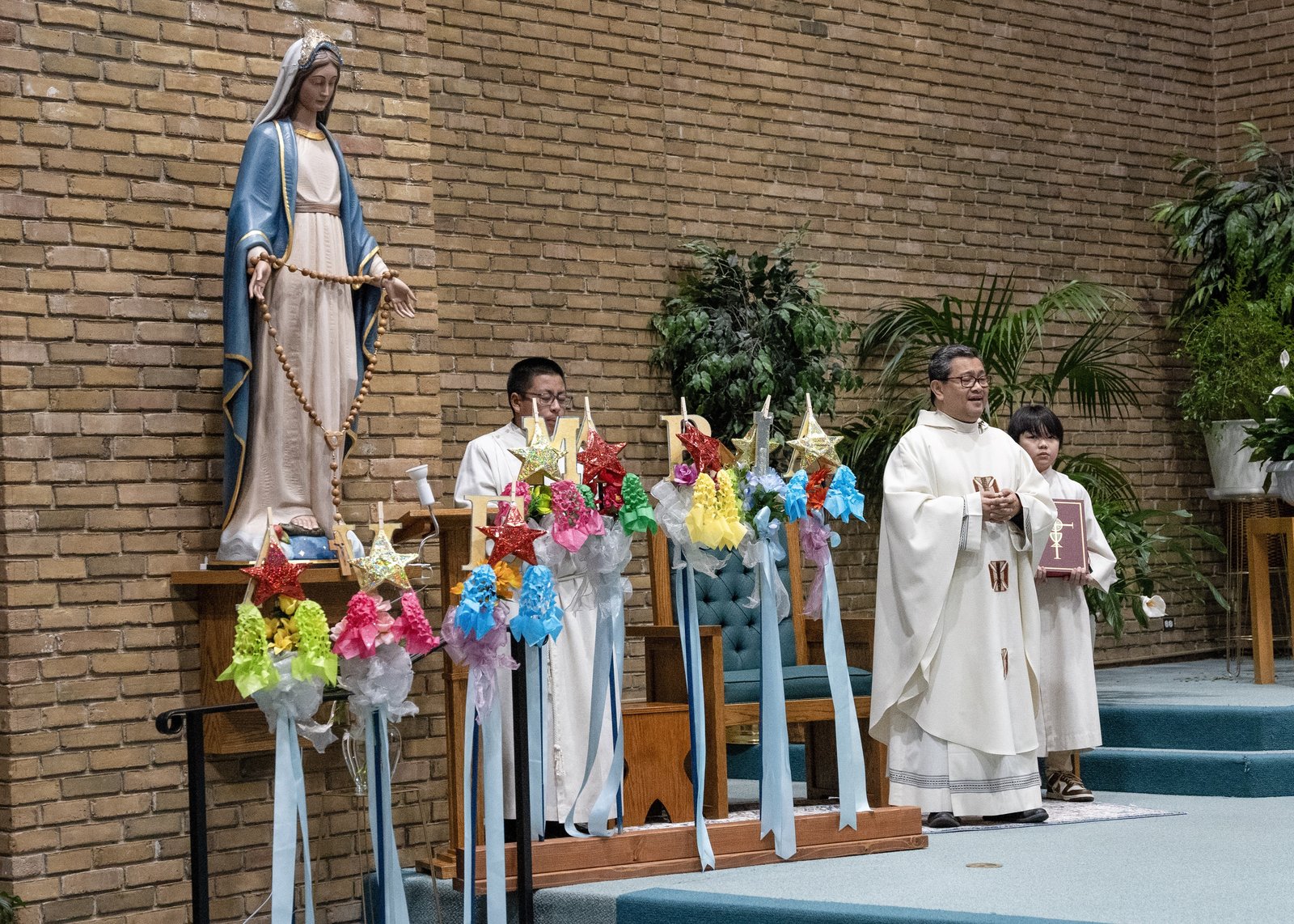 "I invite all of us to receive Christ tonight with the attitude of our mother, our gentle lady. She is always the image, the model for all of us for what it means to receive Christ," Fr. Dango said.