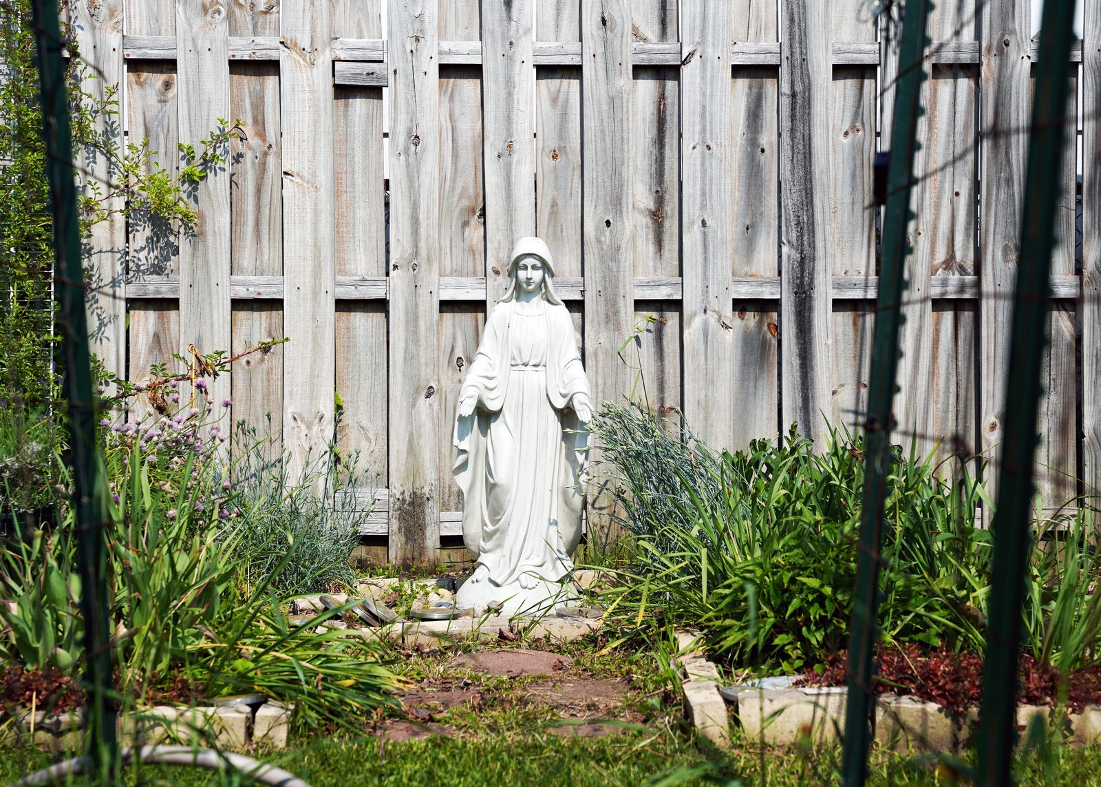 Veridiano-Powell recently ordered a memorial stone with her mother’s name to include in the grotto. She has intentionally incorporated flowers into the vegetable garden in her mother’s honor.