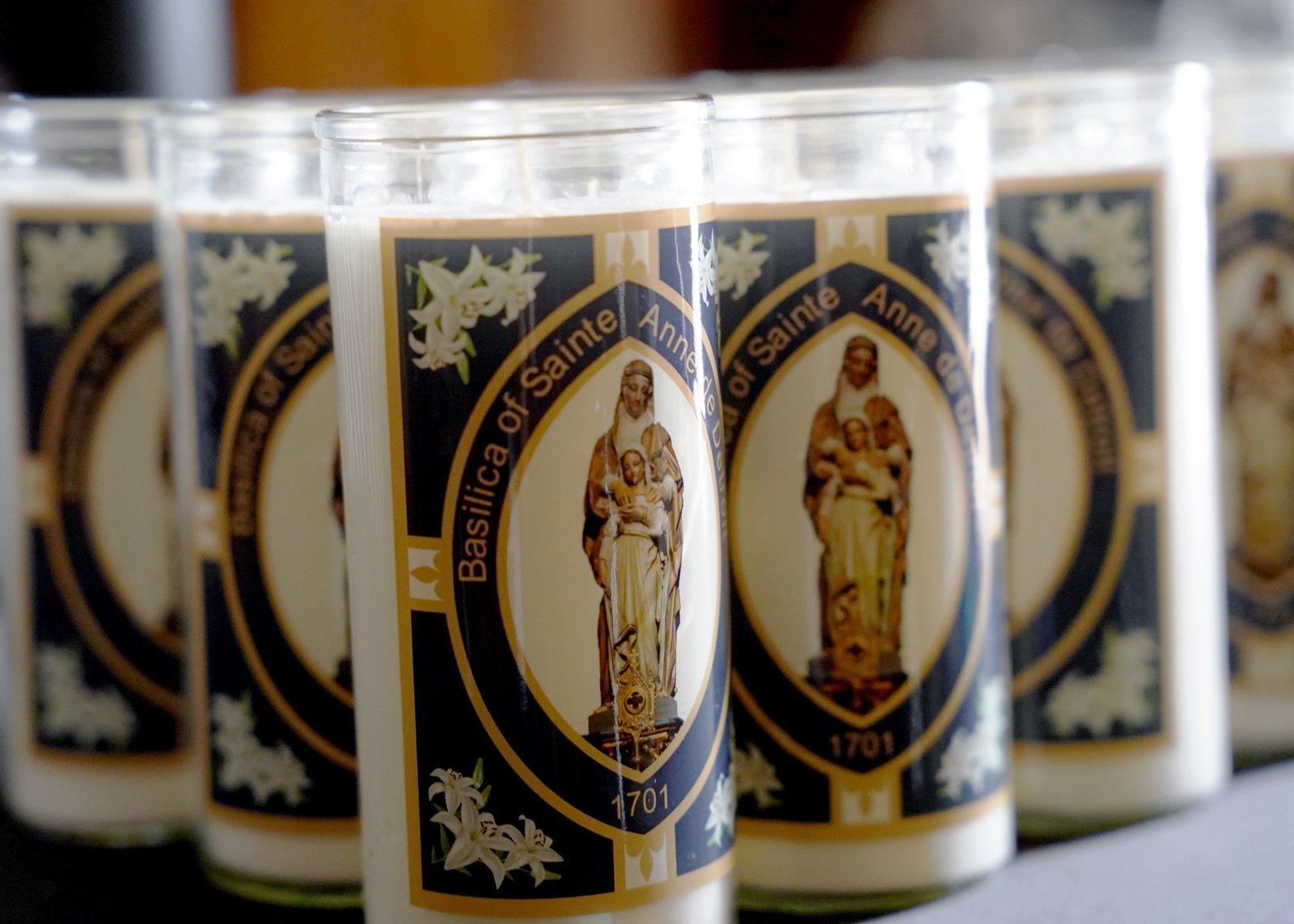 Devotional candles bearing an image of St. Anne with her daughter, the Blessed Virgin Mary, are pictured during the feast day Mass.