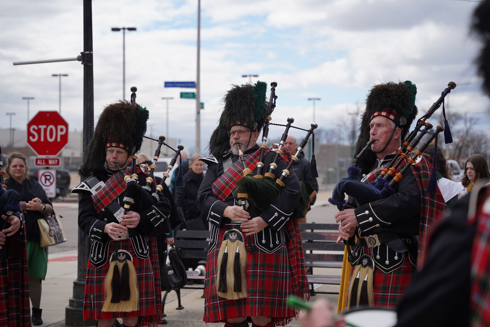 The Celtic Pipes and Drums of Michigan play after Mass in the courtyard in front of Most Holy Trinity Parish.