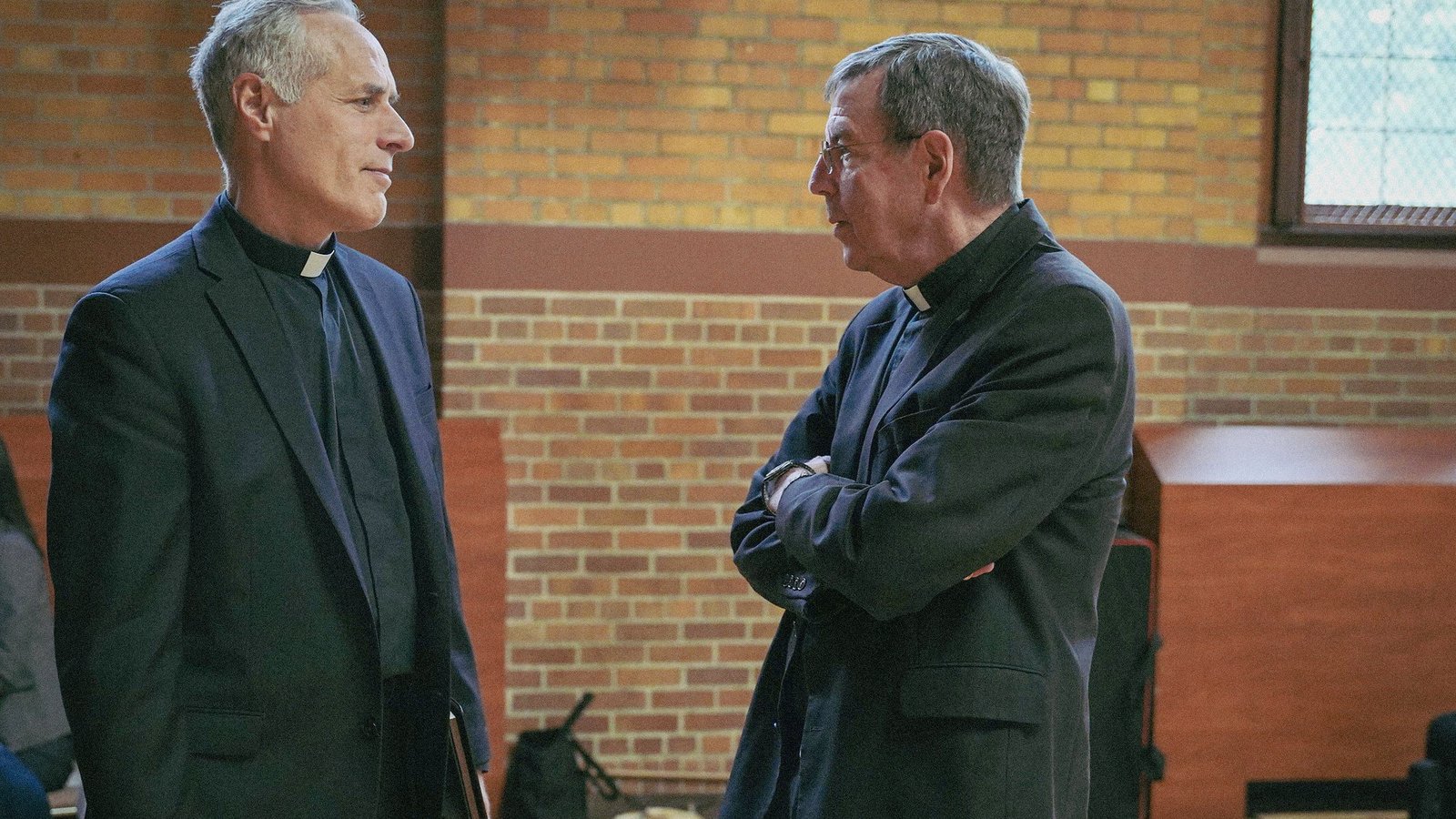 Archbishop Vigneron talks with Fr. Jim Bilot of St. Paul on the Lake Parish in Grosse Pointe Farms during a meeting of priests at Sacred Heart Major Seminary in May 2022. (Valaurian Waller | Detroit Catholic)