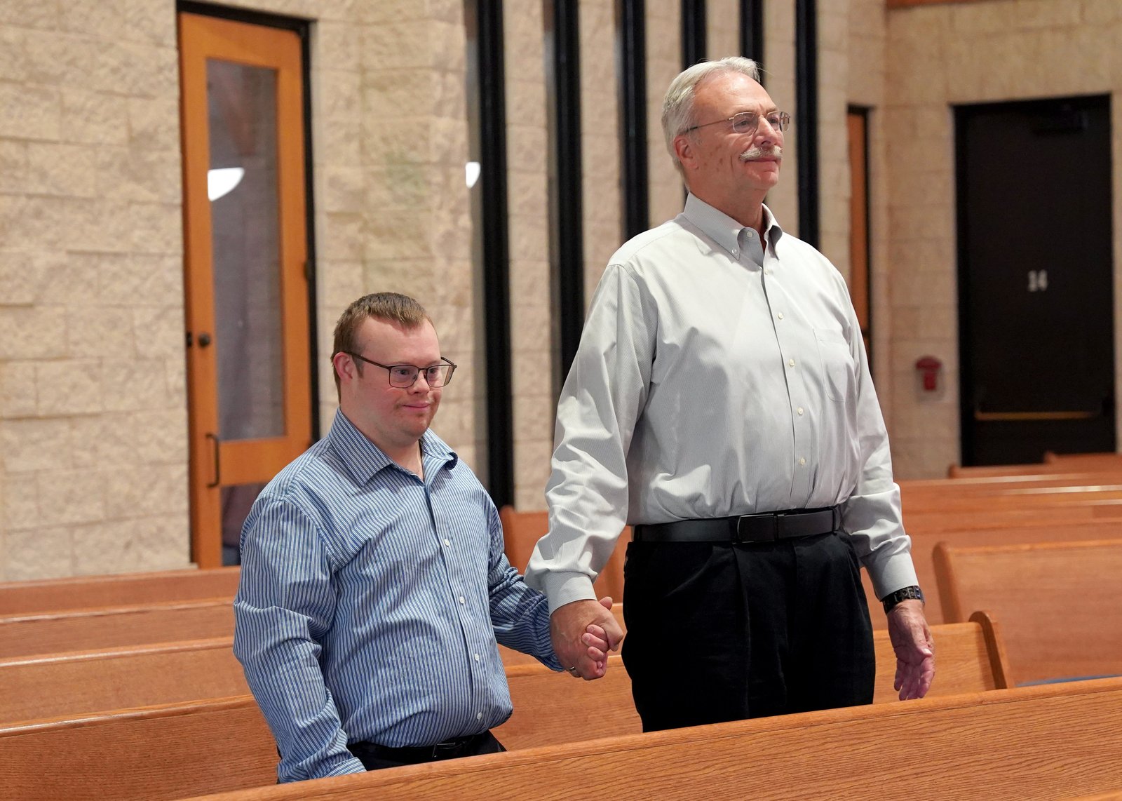 Robby's father, Charles Heil, said his son's infectious smile brightens the lives of parishioners at St. James Parish, who enjoy Robby's dedication and warm personality.