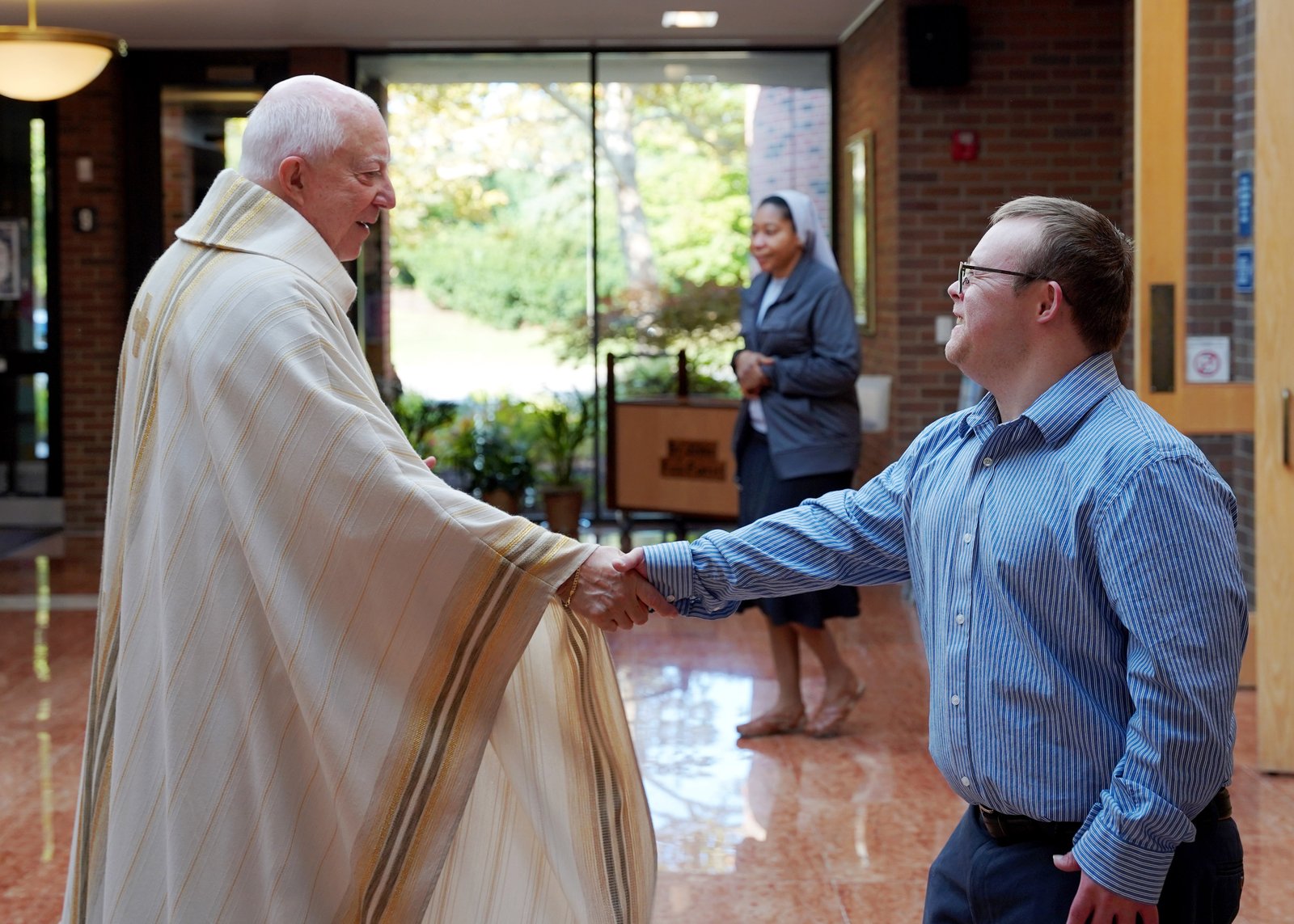 Robby loves volunteering at St. James and takes his role as an extraordinary minister of Holy Communion very seriously, his father said.