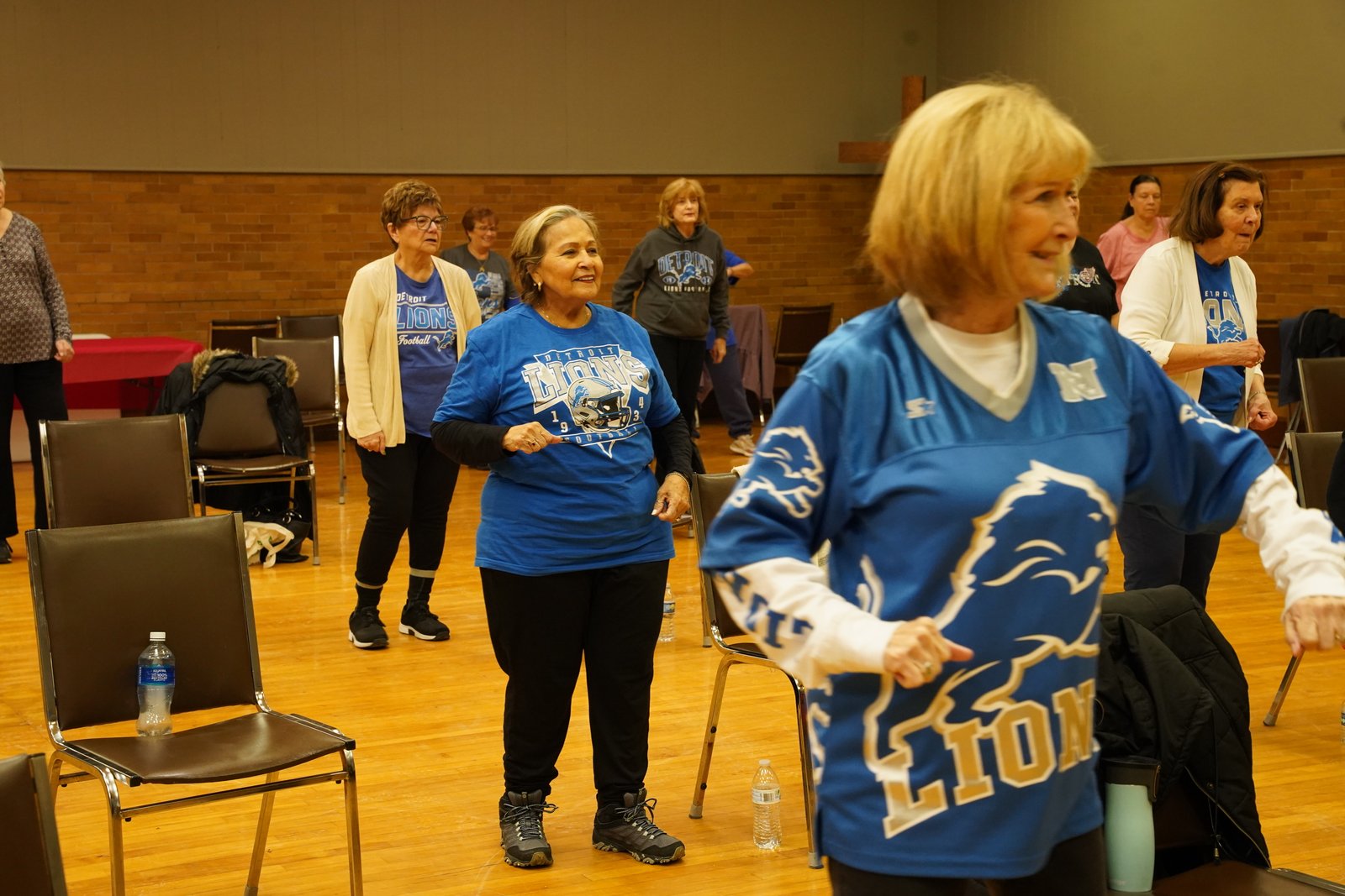 Detroit Catholic visited the St. Louis Parish fitness class during “Team Spirit Day,” when many participants were donning Detroit Lions gear.