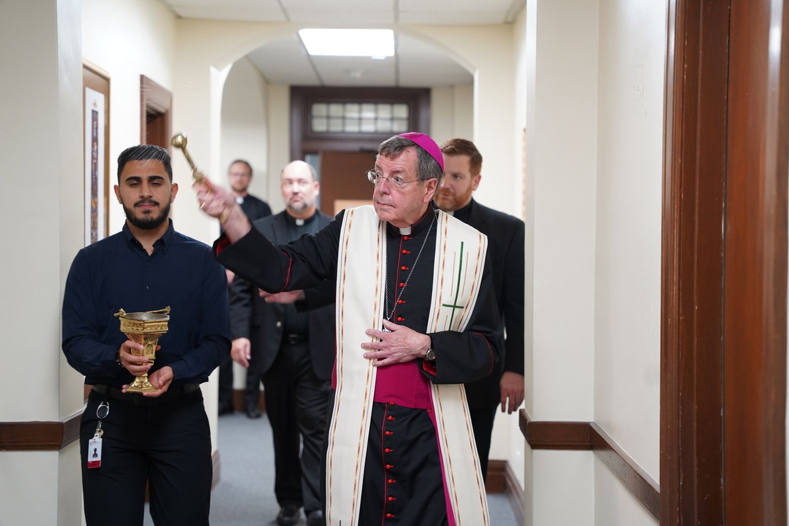 Archbishop Vigneron blesses dorm rooms and common areas in a repurposed wing of Sacred Heart Major Seminary reserved for first-year seminarians Sept. 19.