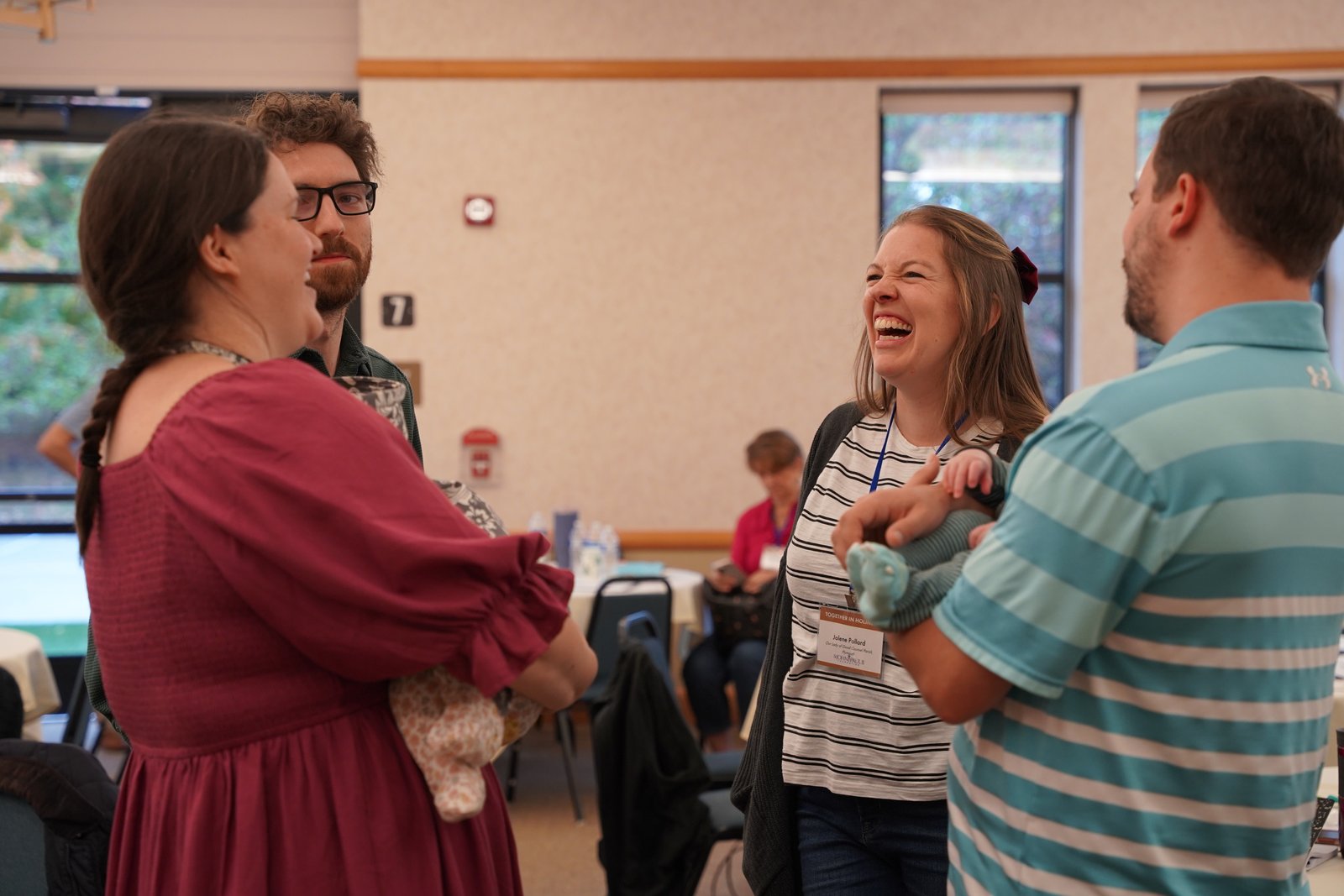Couples laugh during a fellowship portion of the conference. The annual conference, sponsored in part by the St. John Paul II Foundation, aims to strengthen couples' relationships by reminding them of the beauty of their vocation.