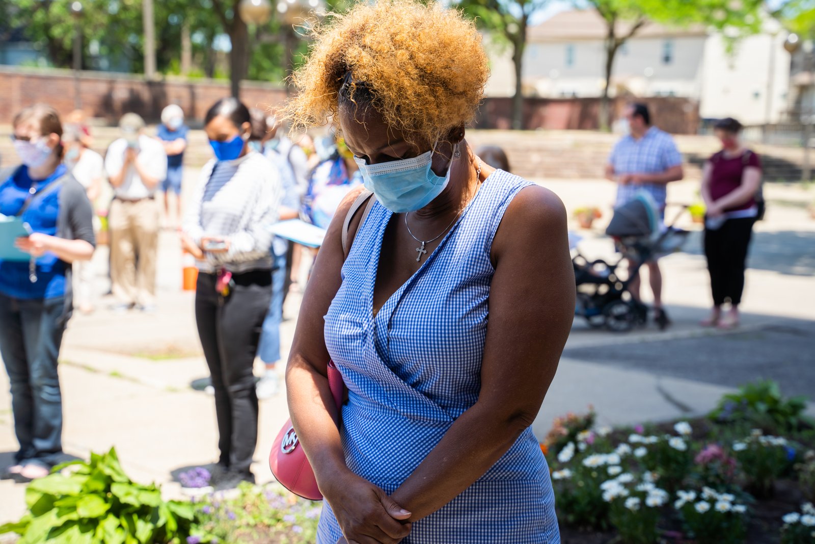 A woman participates in a rosary led by Archbishop Allen H. Vigneron at the Basilica of Ste. Anne in southwest Detroit in June 2020, days after George Floyd was killed by a police officer in Minneapolis, sparking a national outcry and calls for racial justice. (Valaurian Waller | Detroit Catholic)