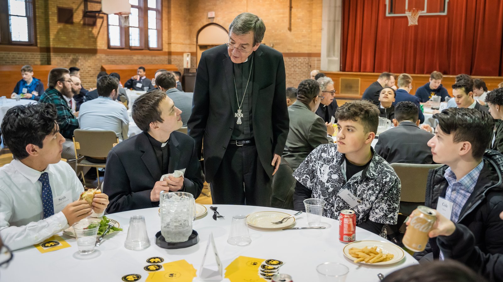 Archbishop Vigneron chats with Fr. Kevin Roelant and young men visiting Sacred Heart Major Seminary for a vocational discernment evening March 28, 2023. (Valaurian Waller | Detroit Catholic)