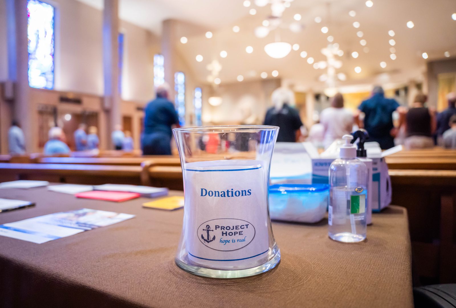 A donation jar for Project Hope of Michigan is pictured after Mass at St. Clare of Montefalco Parish in Grosse Pointe Park on Aug. 28. Fr. Andrew Kowalczyk, CSMA, who leads the St. Clare community, said the annual effort is a way for the community to show Christ's love to someone in need. (Valaurian Waller | Detroit Catholic)